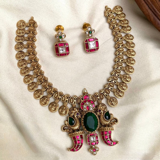 GOLD FINISH LAKSHMI COIN FUSION NECKLACE SET WITH KEMP STONES PEACOCK PENDANT