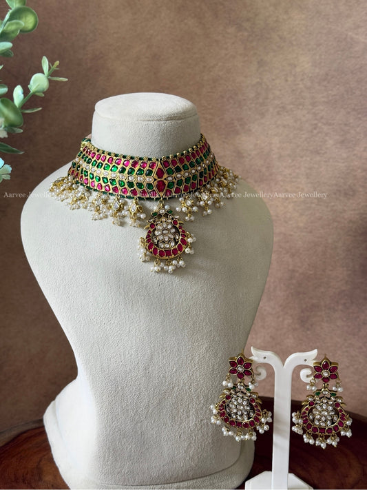 JADAU KUNDAN HIGH NECK CHOKER SET WITH RUBY/ GREEN / WHITE STONES AND PEARLS