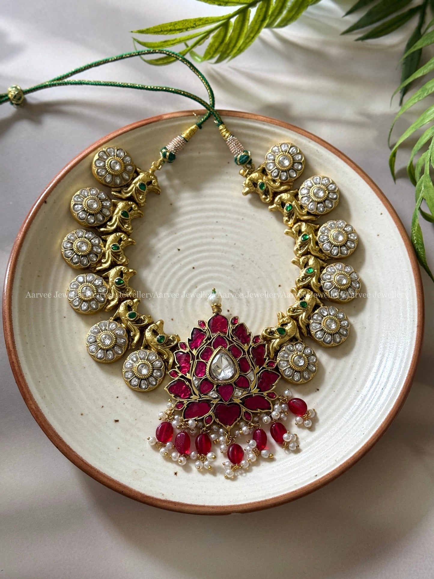 JADAU KUNDAN WHITE STONE BUTTA NECKLACE SET WITH RUBY LOTUS PENDANT AND RUBY BEADS