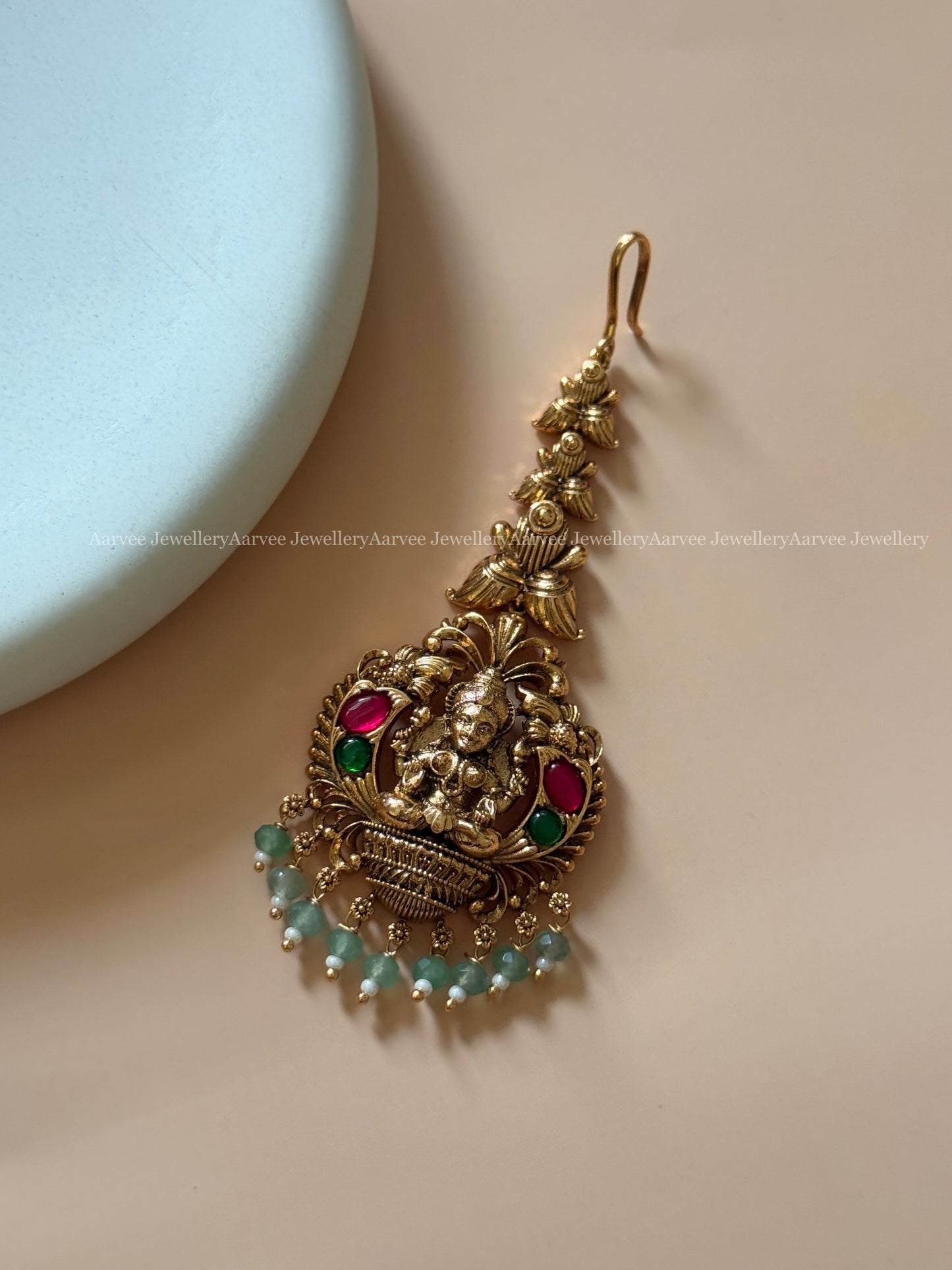 ANTIQUE GOLD LAKSHMI MOTIF TIKKA WITH PASTEL BEADS