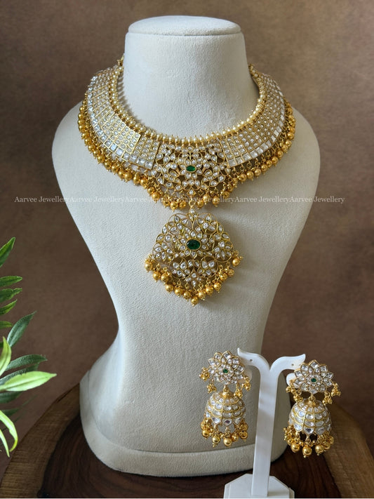 JADAU KUNDAN STATEMENT NECKLACE & FLORAL JHUMKI WITH WHITE STONES & GOLD BEADS