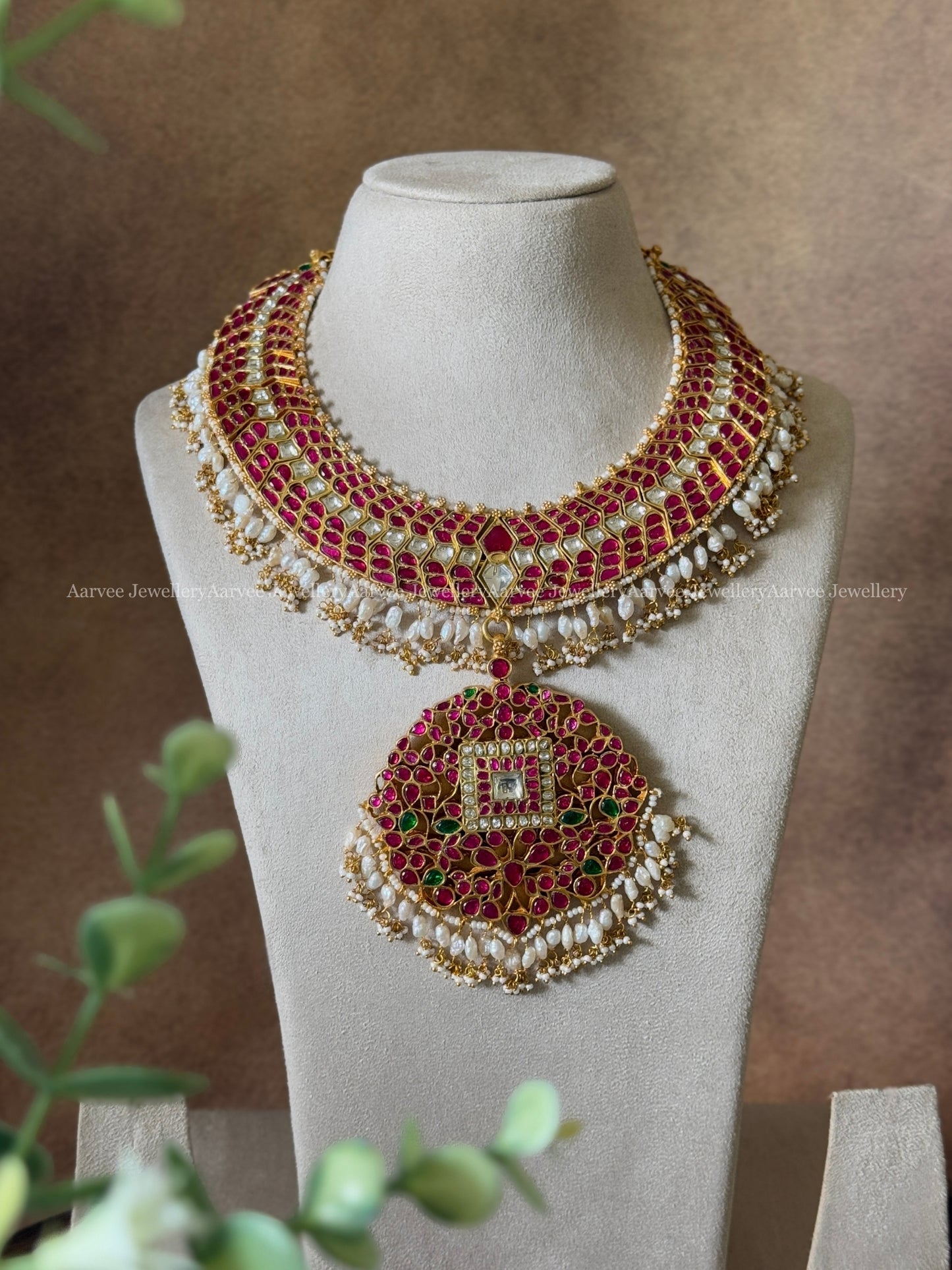 JADAU KUNDAN RUBY STONE STATEMENT NECKLACE WITH FLORAL PENDANT WITH RICE PEARLS