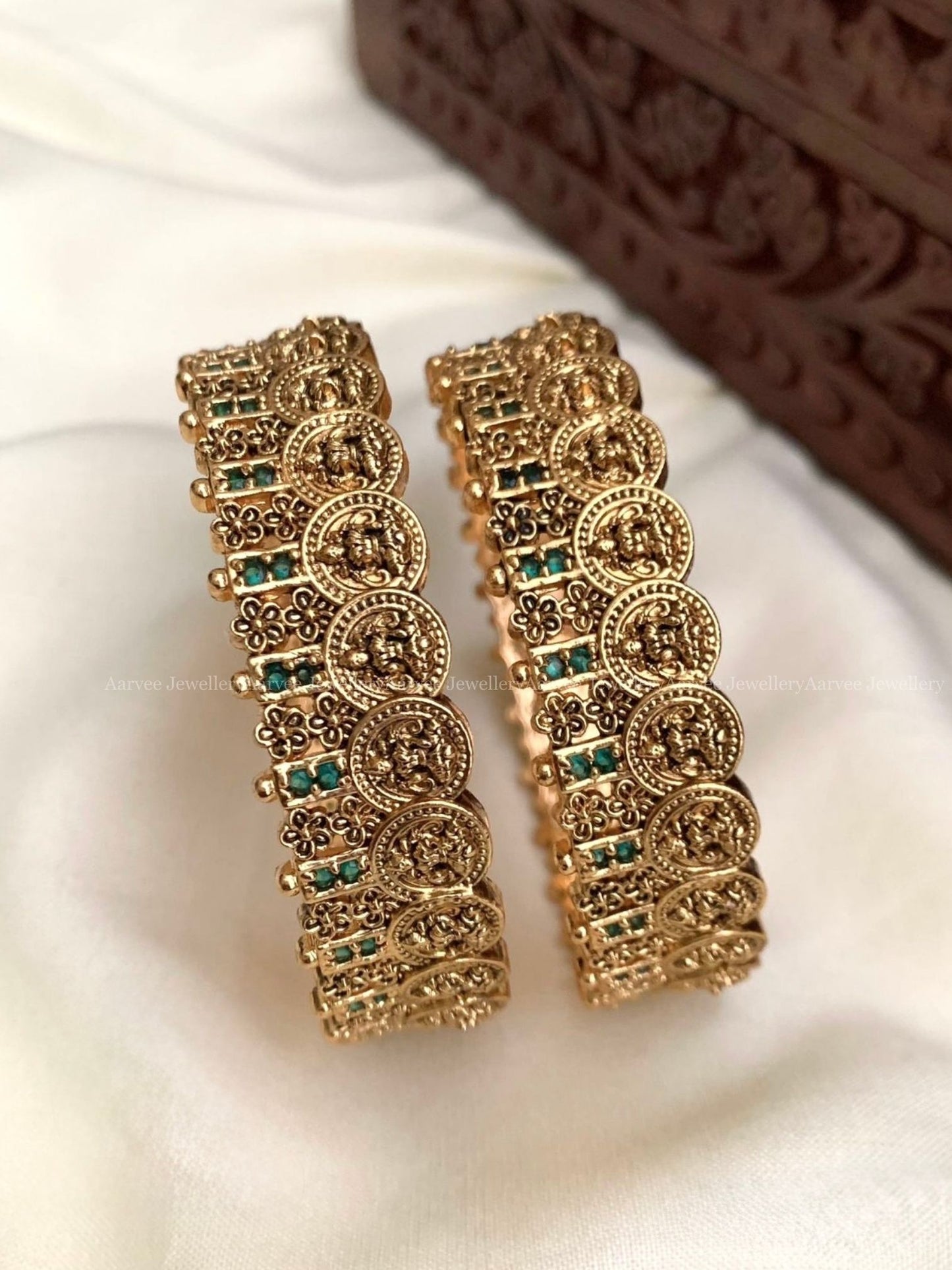GOLD FINISH LAKSHMI COIN BANGLES WITH GREEN STONES