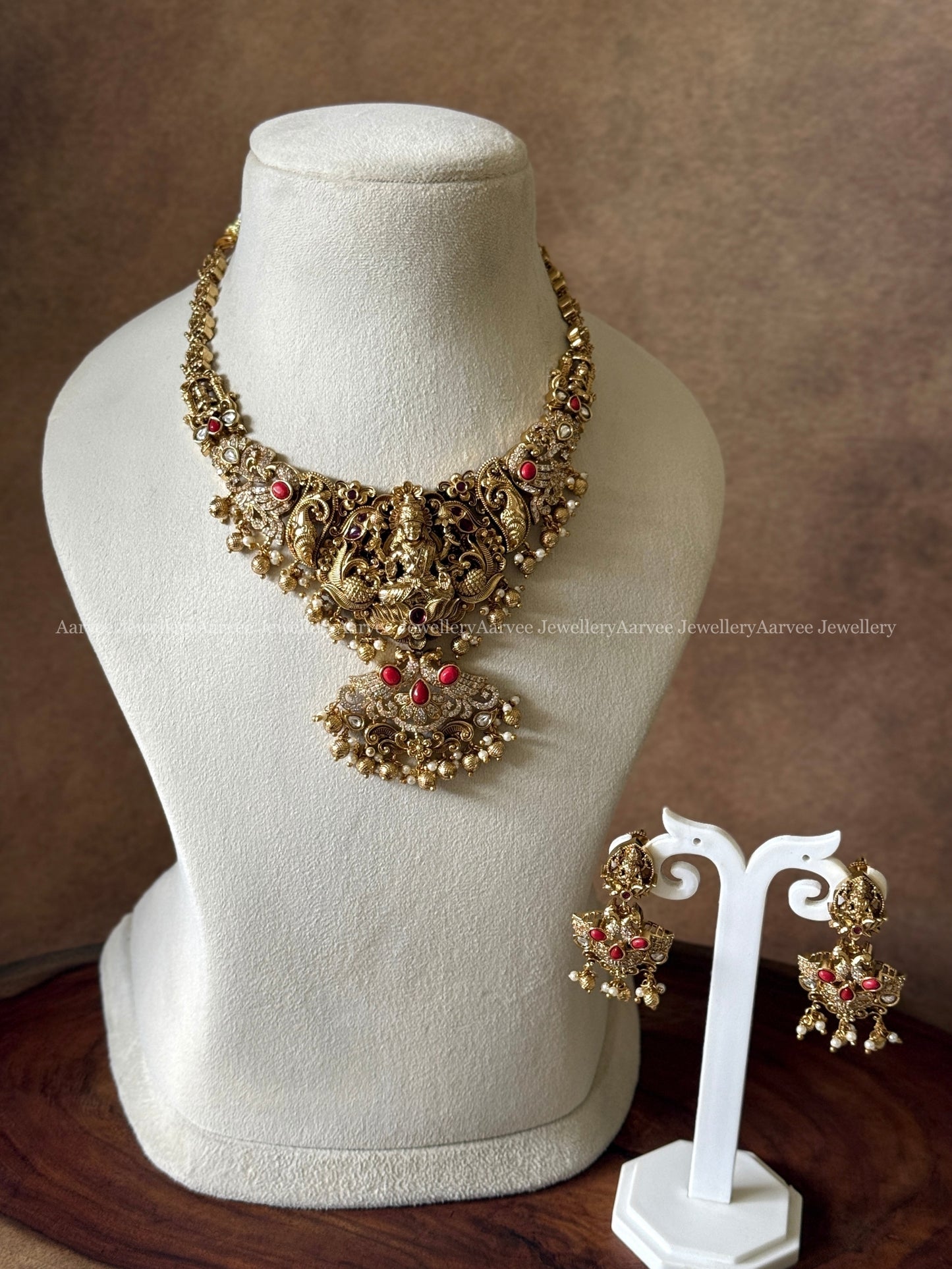 GOLD FINISH LAKSHMI NECKALCE SET WITH CORAL STONES