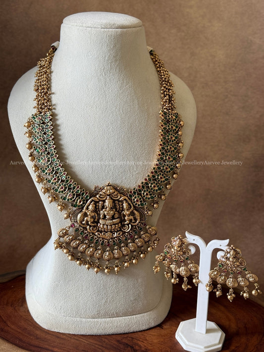 GOLD PEARL BUNCH GREEN STONE MID LENGTH HARAM SET WITH LAKSHMI PENDANT & GOLD BEADS