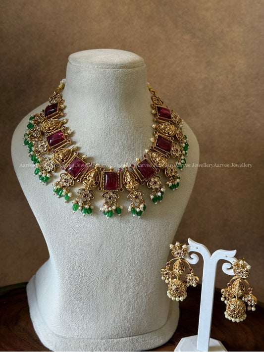GOLD FINISH LAKSHMI AND RUBY STONE NECKLACE SET WITH GREEN BEADS