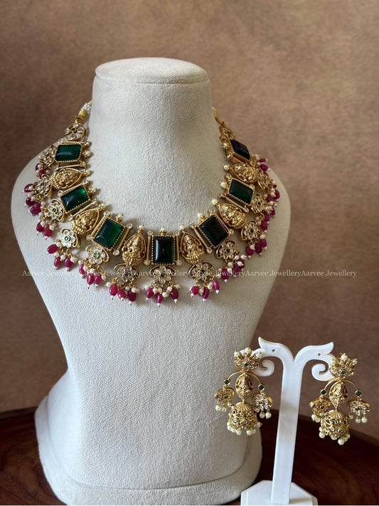 GOLD FINISH LAKSHMI AND GREEN STONE NECKLACE SET WITH RUBY BEADS
