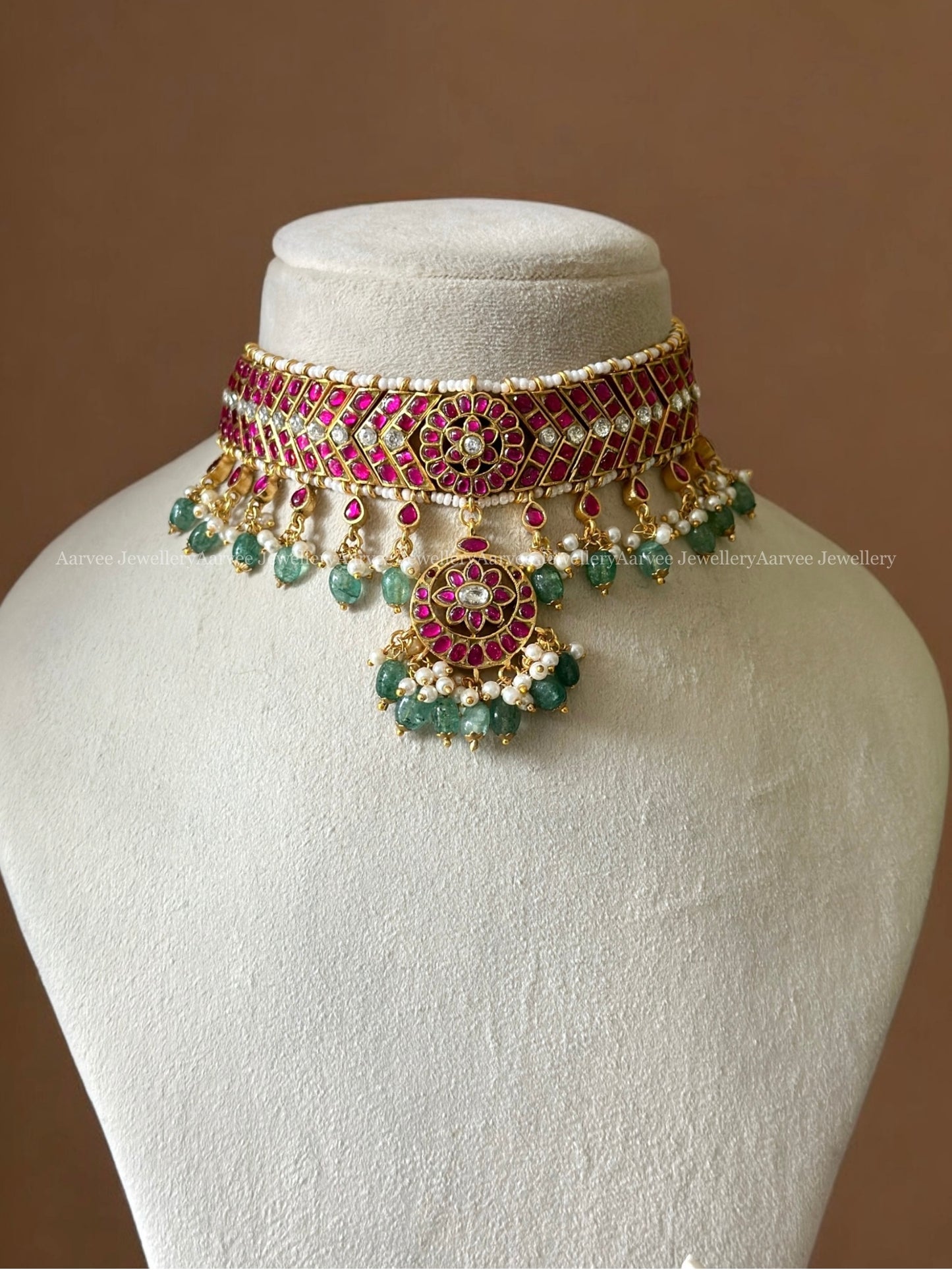RUBY STONE CHOKER SET PAIRED WITH A BIG SIZED BUTTA JHUMKI WITH PASTEL BEADS