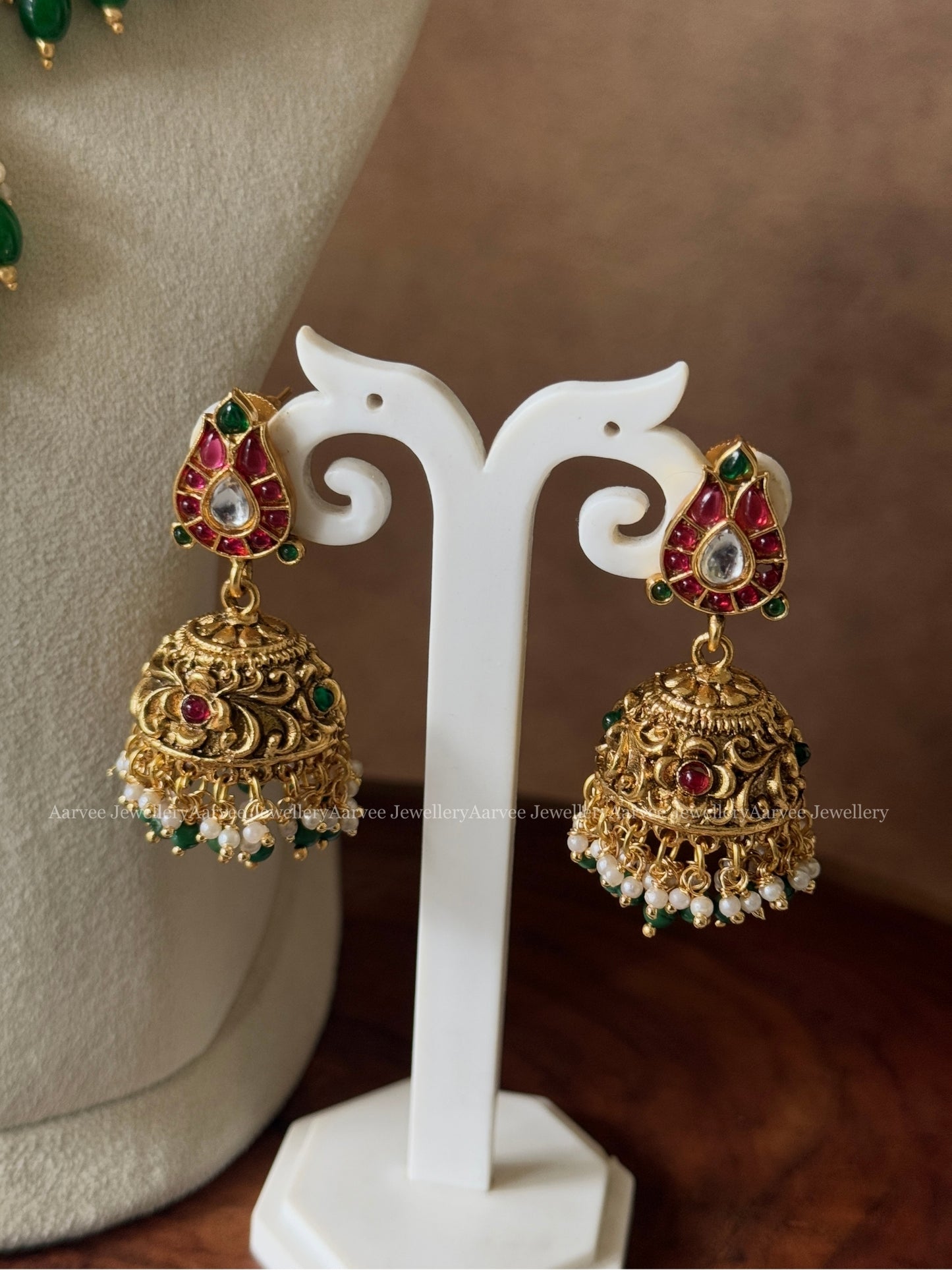 GOLD FINISH KANTI PEACOCK NECKLACE SET WITH GREEN BEADS