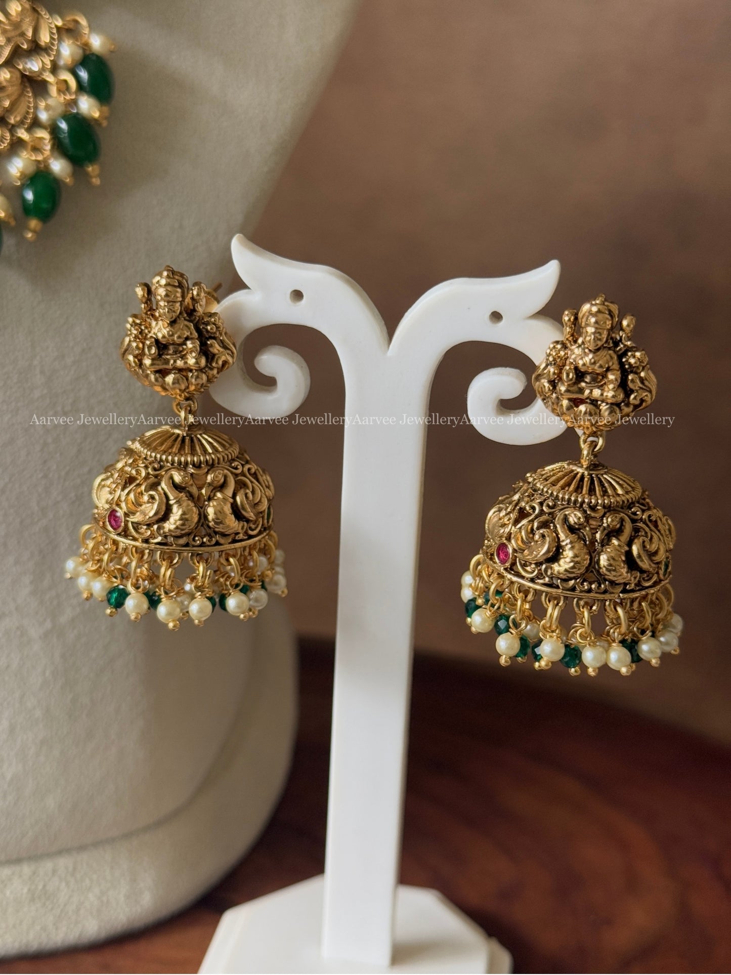 GOLD FINISH PEACOCK & LAKSHMI NECKLACE SET WITH GREEN BEADS