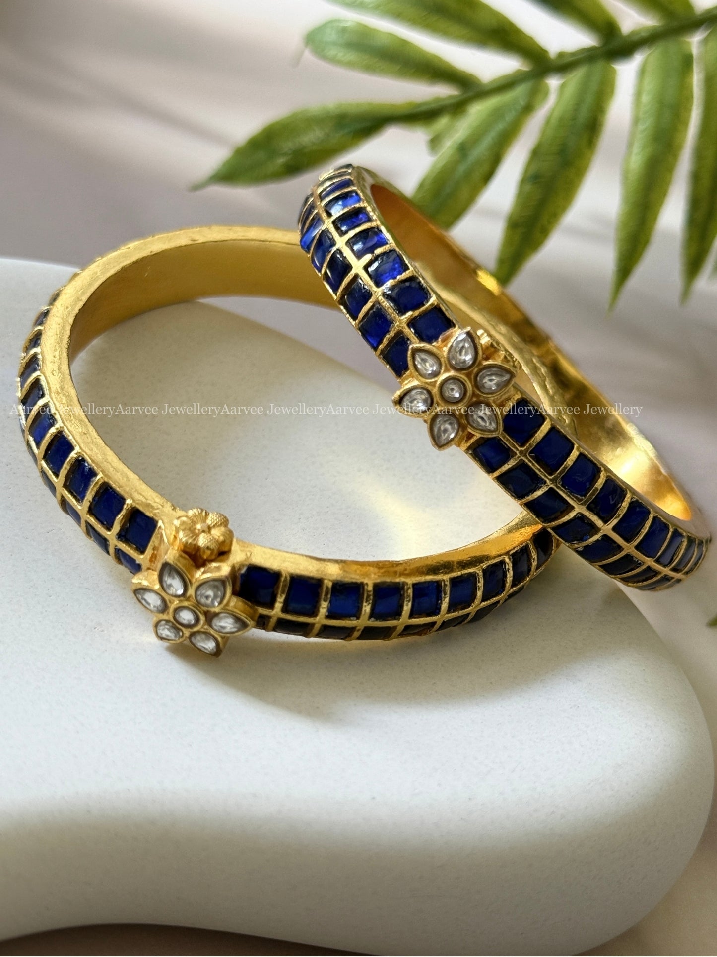 JADAU KUNDAN FLORAL KADA BANGLE WITH BLUE/WHITE STONES