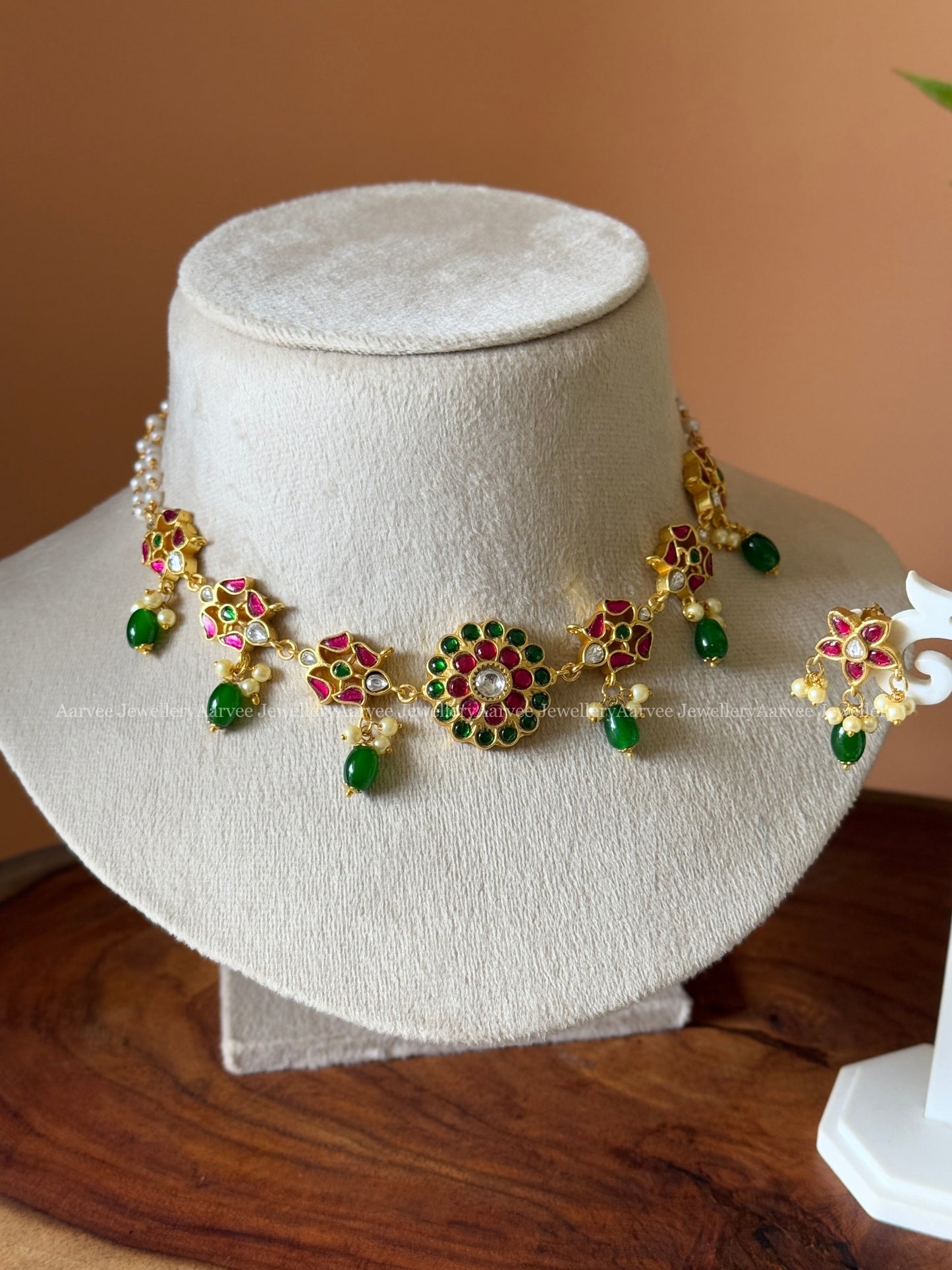 PEARL LINE JADAU KUNDAN CHOKER SET WITH ROUND PENDANT AND GREEN BEAD DROPS