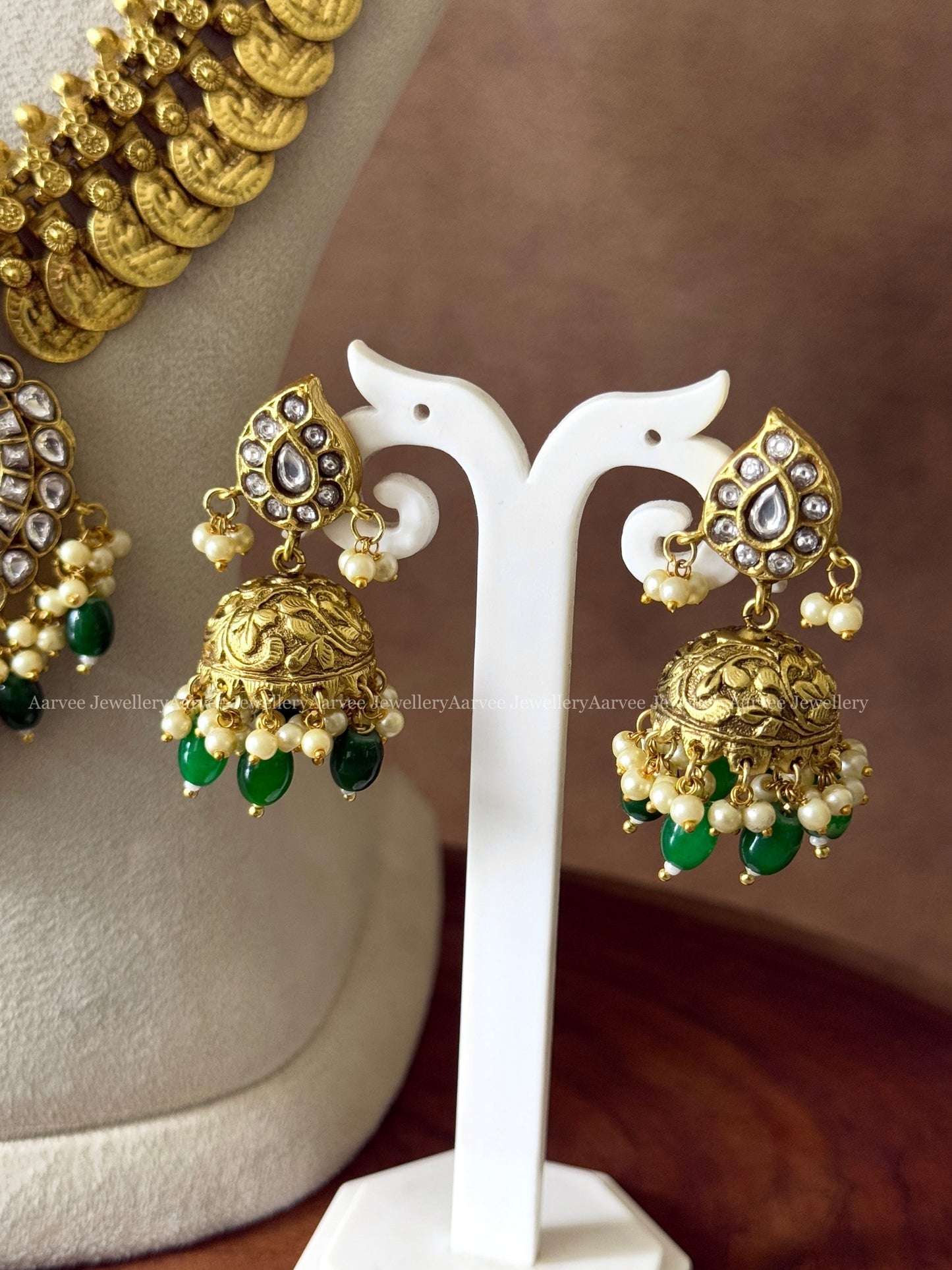 COIN MIDLENGTH CHAIN WITH JADAU KUNDAN WHITE STONE PEACOCK PENDANT & JHUMKI IN GREEN BEADS