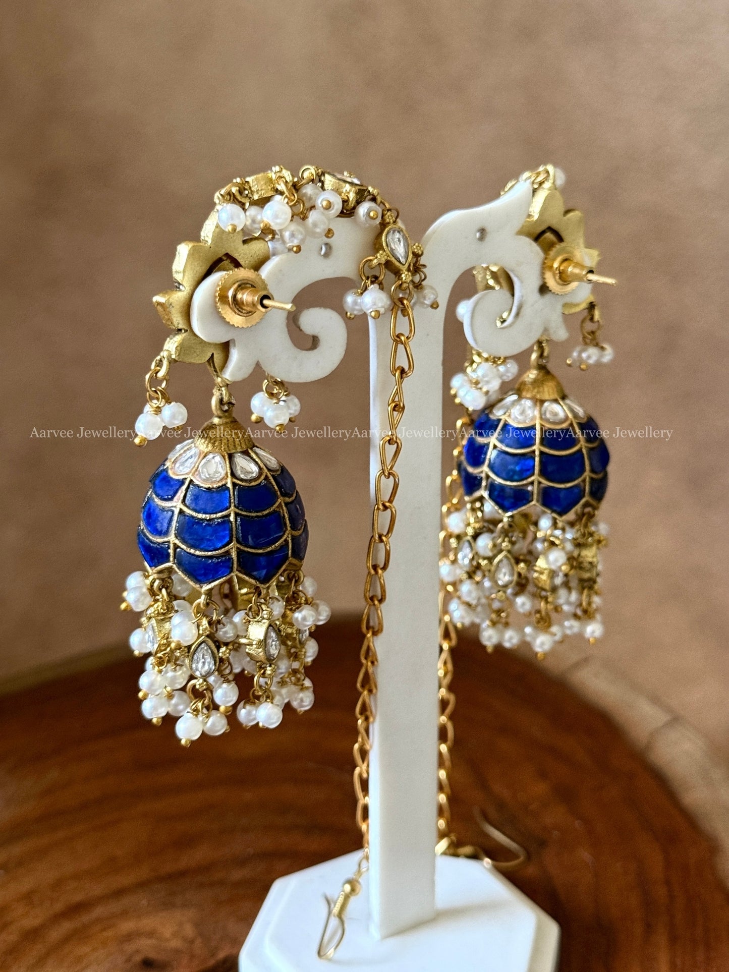 JADAU KUNDAN BLUE /WHITE STONE FLORAL JHUMKI WITH ATTACHED EAR CHAIN