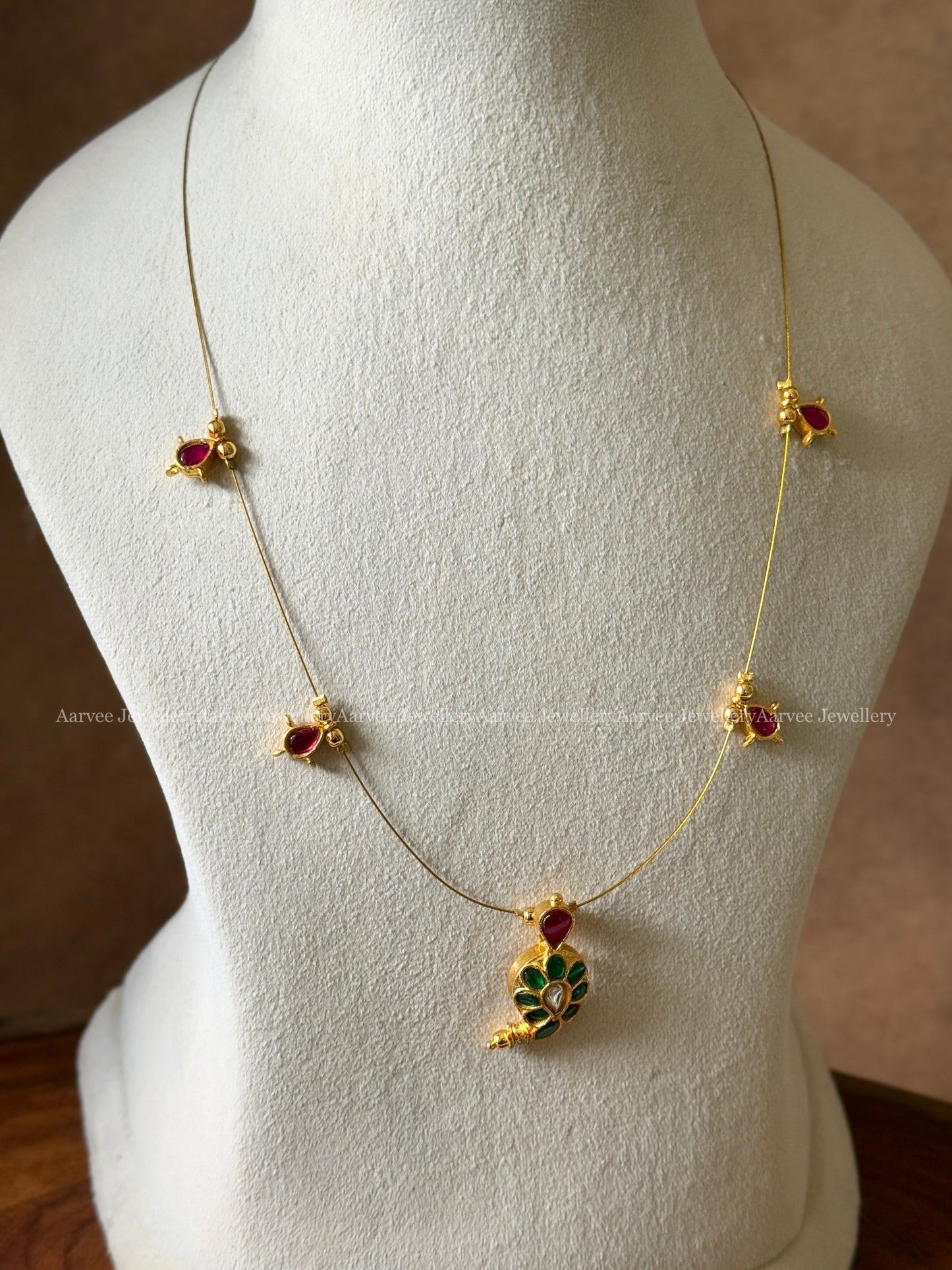 INVISIBLE CHAIN WITH JADAU KUNDAN GREEN STONE MANGO MOTIF PENDANT