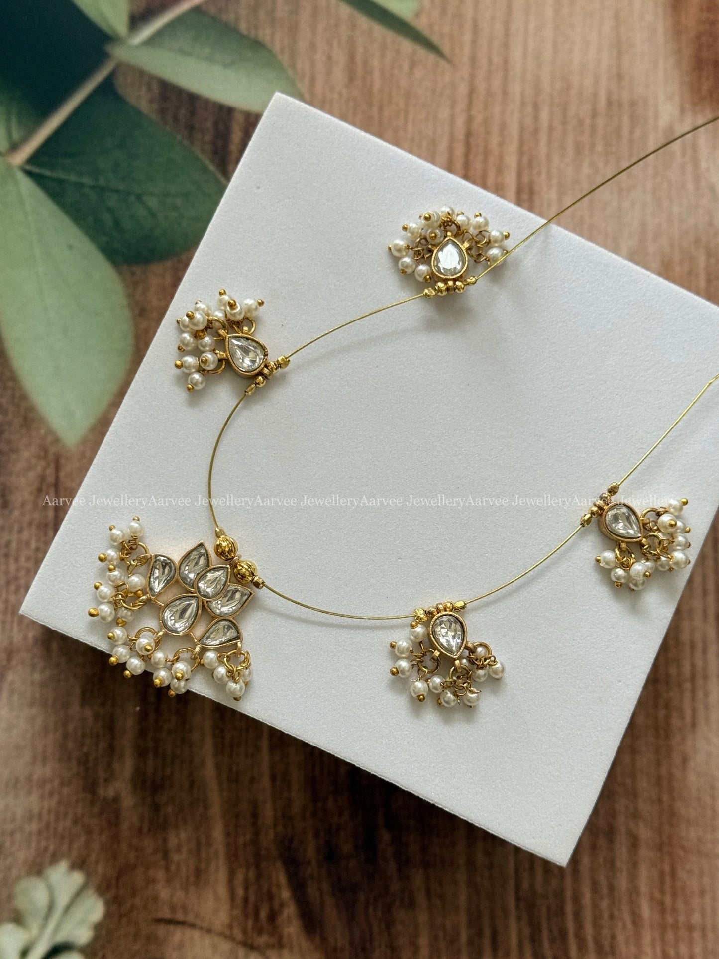 INVISIBLE CHAIN WITH LOTUS PENDANT IN WHITE KUNDAN STONE