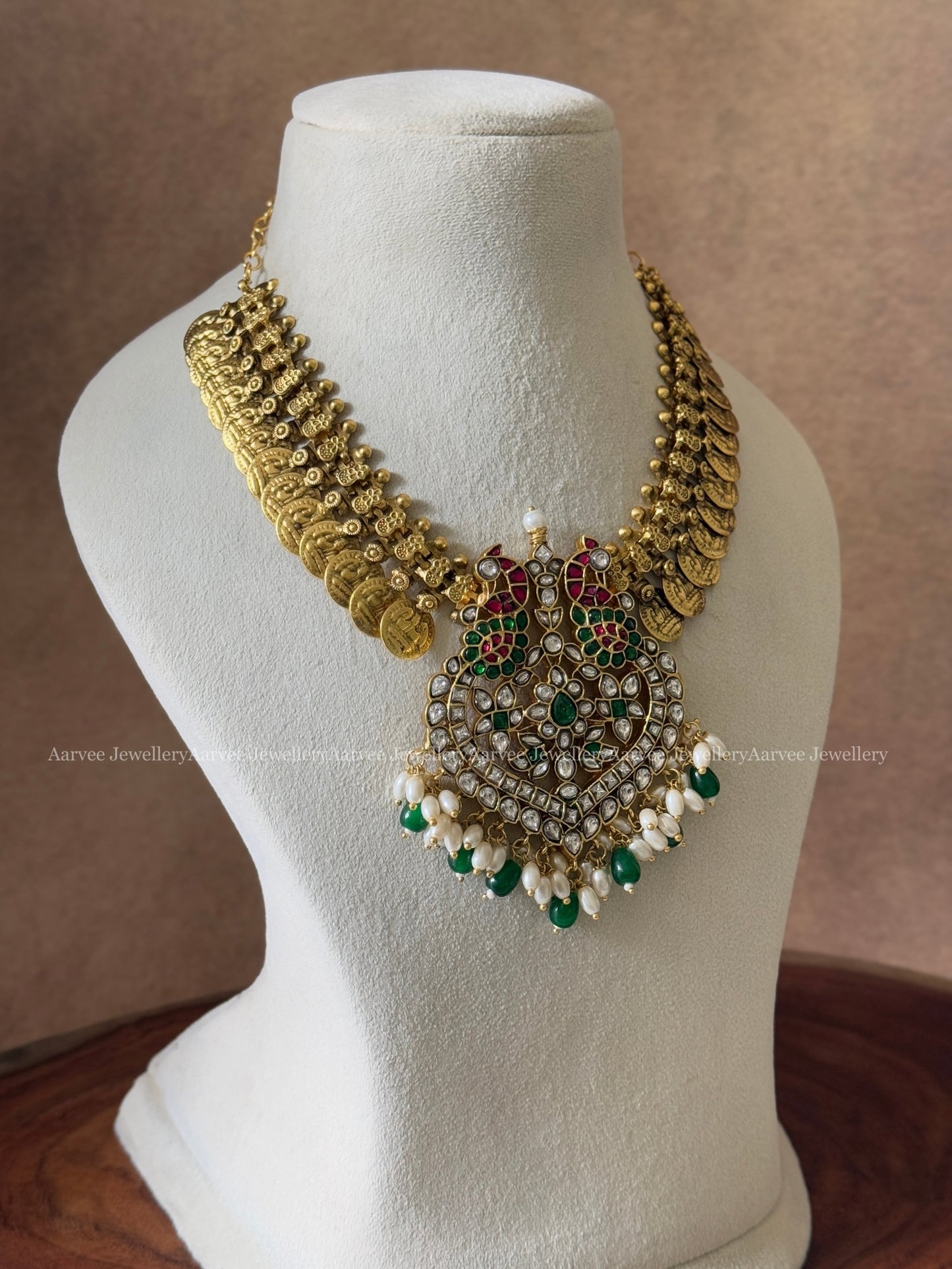 JADAU KUNDAN COIN NECKLACE WITH WHITE STONE PEACOCK PENDANT AND MIX OF GREEN & PEARL BEADS