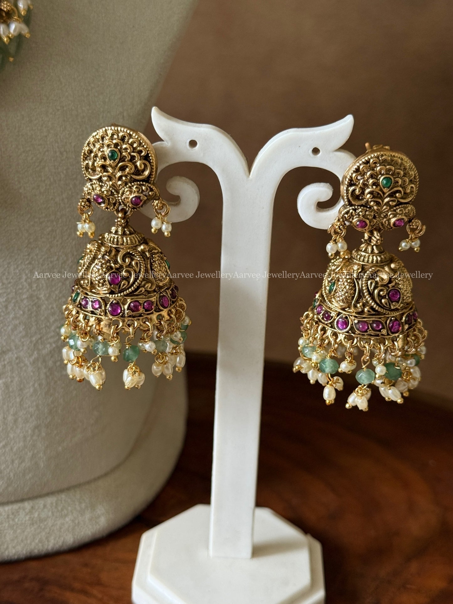 PREMIUM ANTIQUE GOLD JALEBI NECKLACE SET WITH PEACOCK MOTIF AND PASTEL BEADS
