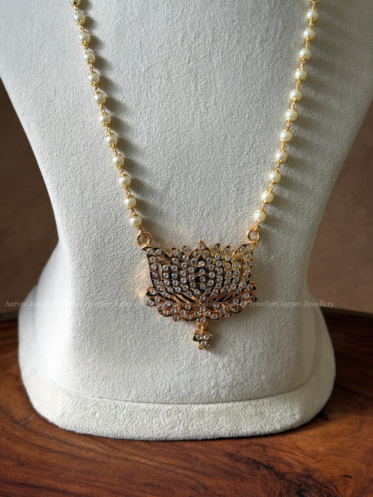 SINGLE LINE PEARL MID LENGTH CHAIN WITH LOTUS WHITE STONE PENDANT