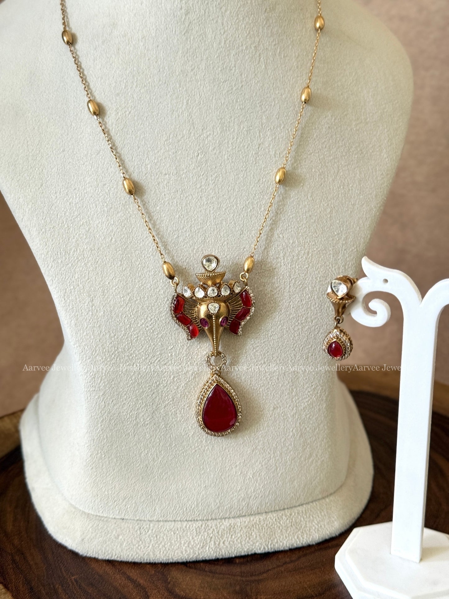 GOLD MID LENGTH CHAIN SET WITH ELEPHANT PENDANT IN RUBY STONES