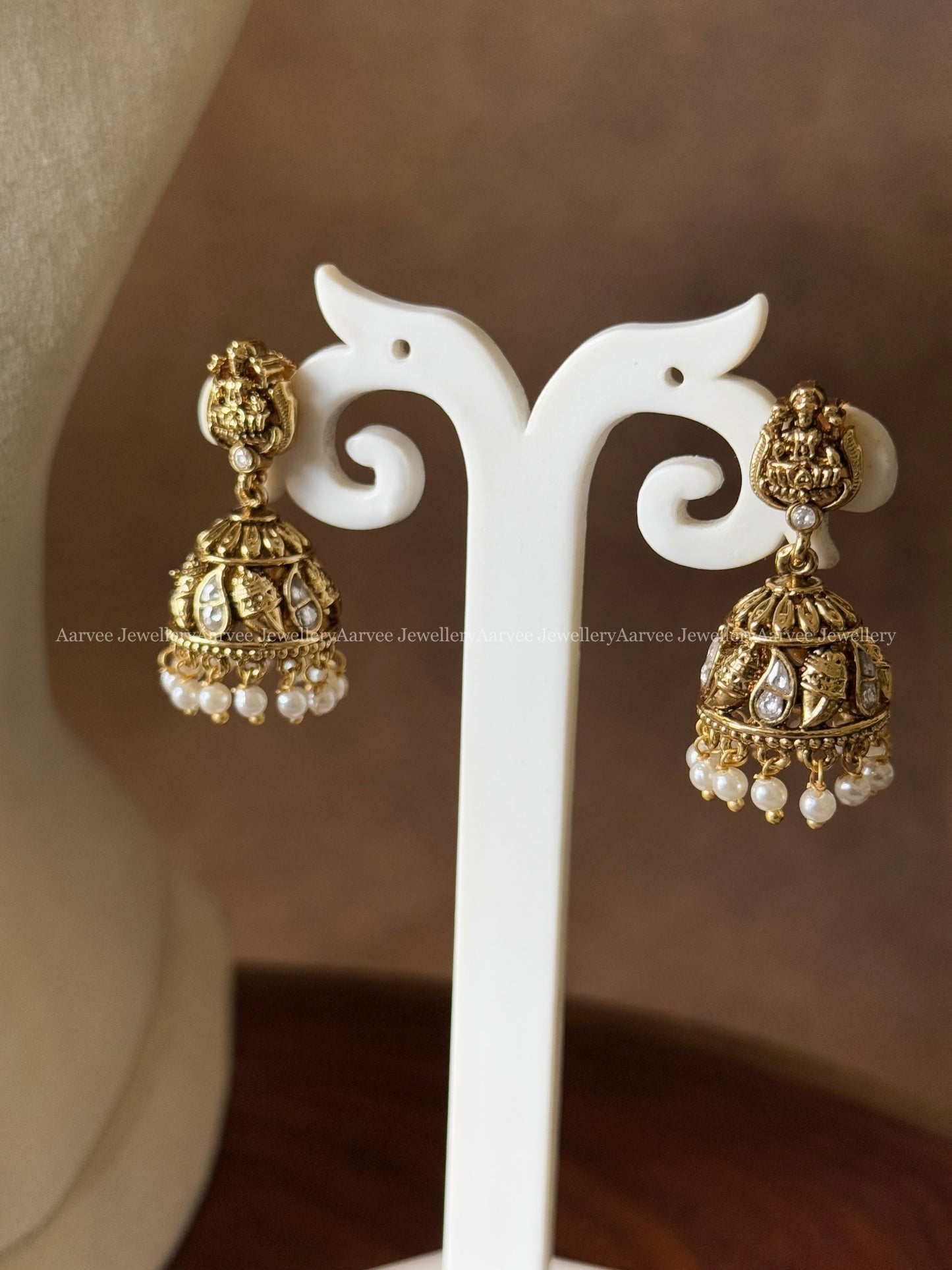 ANTIQUE GOLD TONE LAKSHMI AND WHITE STONE HARAM SET