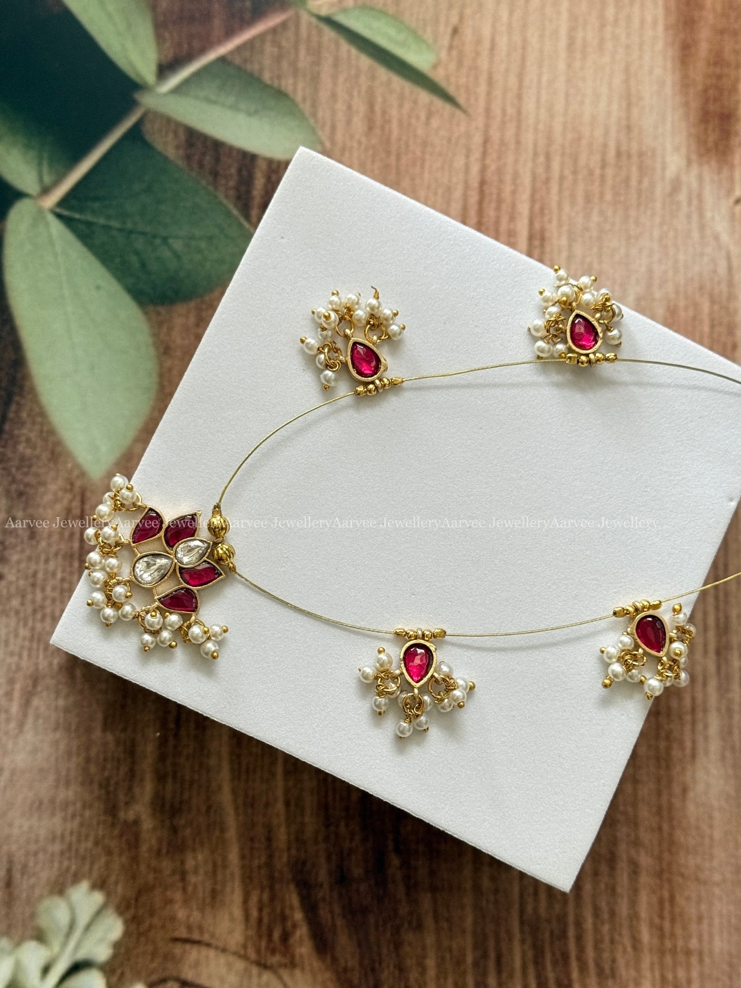 INVISIBLE CHAIN WITH LOTUS PENDANT IN RUBY / WHITE KUNDAN STONE