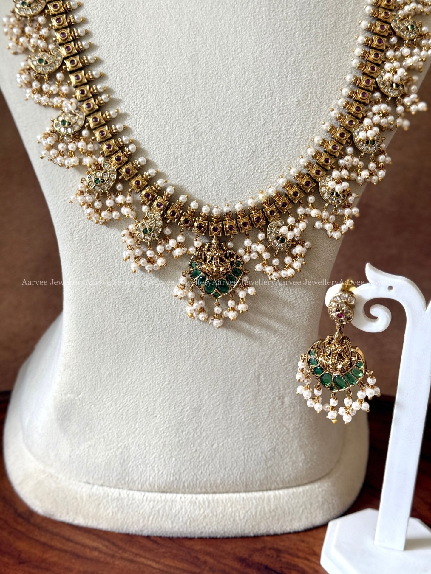 GOLD FINISH GUTTA PUSALU HARAM SET WITH LAKSHMI PENDANT AND GREEN STONES