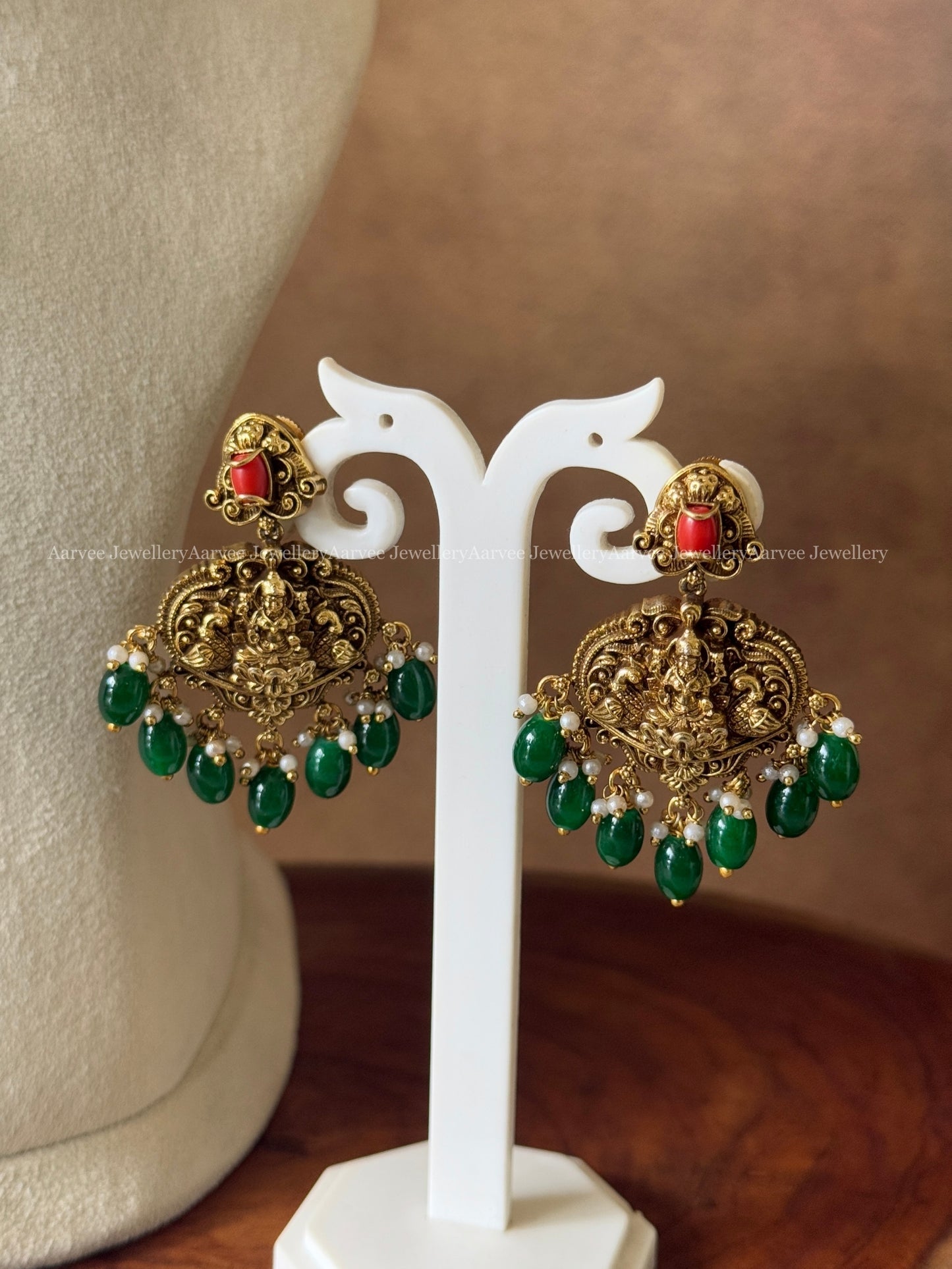 GOLD FINISH CORAL STONE KANTI NECKLACE SET WITH LAKSHMI PENDANT AND GREEN BEADS