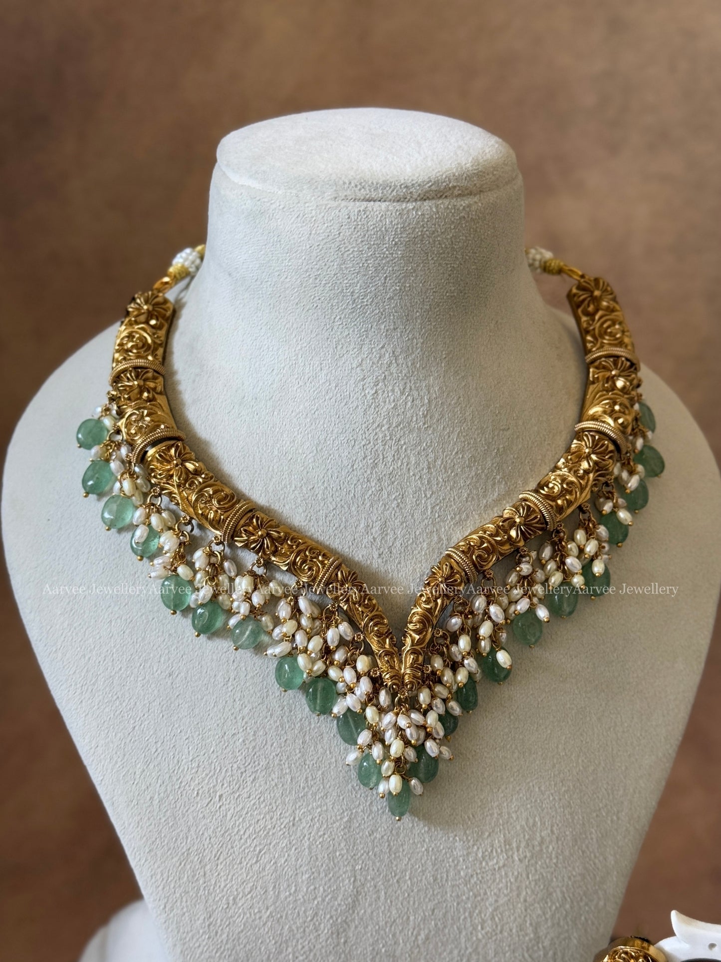GOLD FINISH KANTI V SHAPE NECKLACE SET WITH PASTEL BEADS