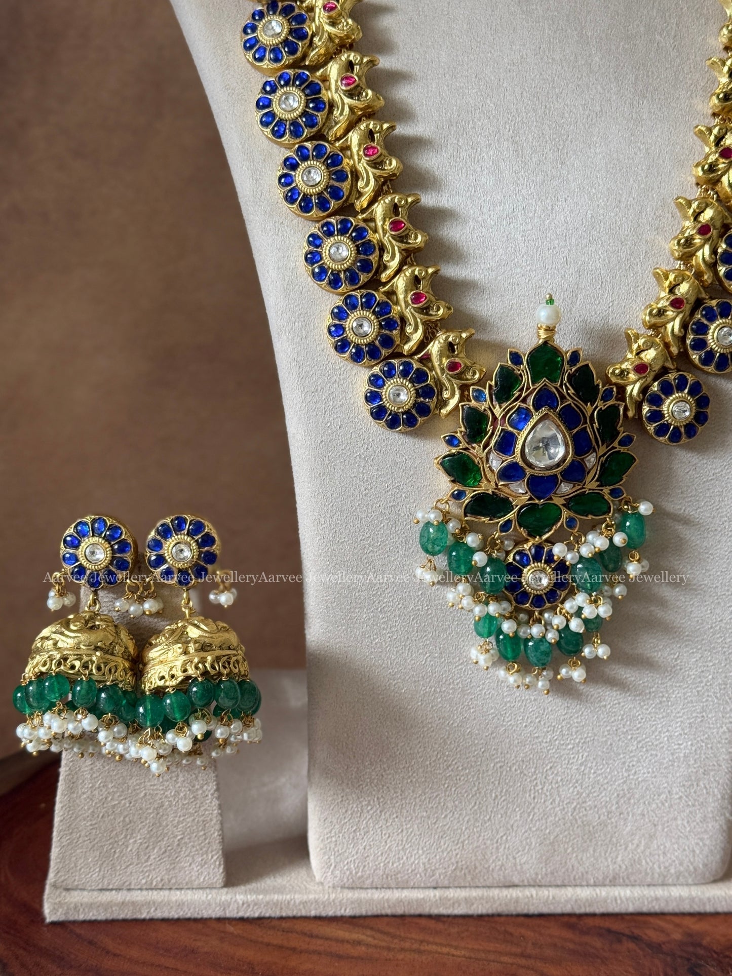 JADAU KUNDAN BLUE STONE BUTTA HARAM SET WITH LOTUS PENDANT IN GREEN BEADS