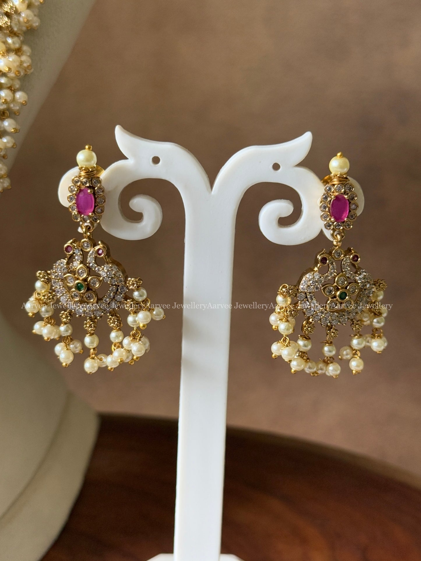 CZ STONES MID LENGTH HARAM SET WITH PEARL BUNCHES