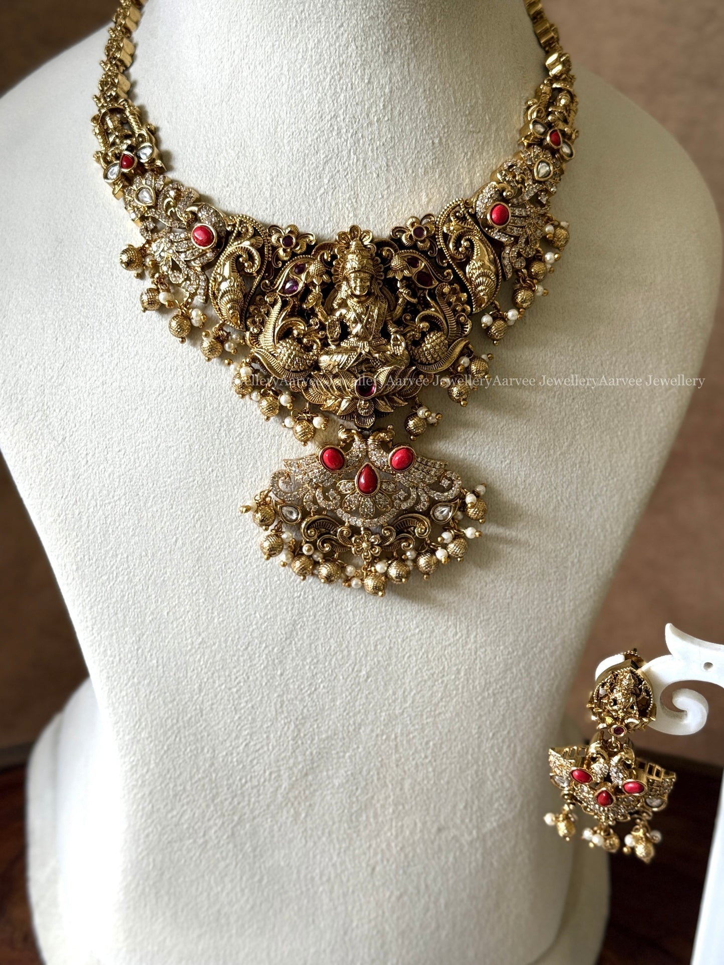 GOLD FINISH LAKSHMI NECKALCE SET WITH CORAL STONES