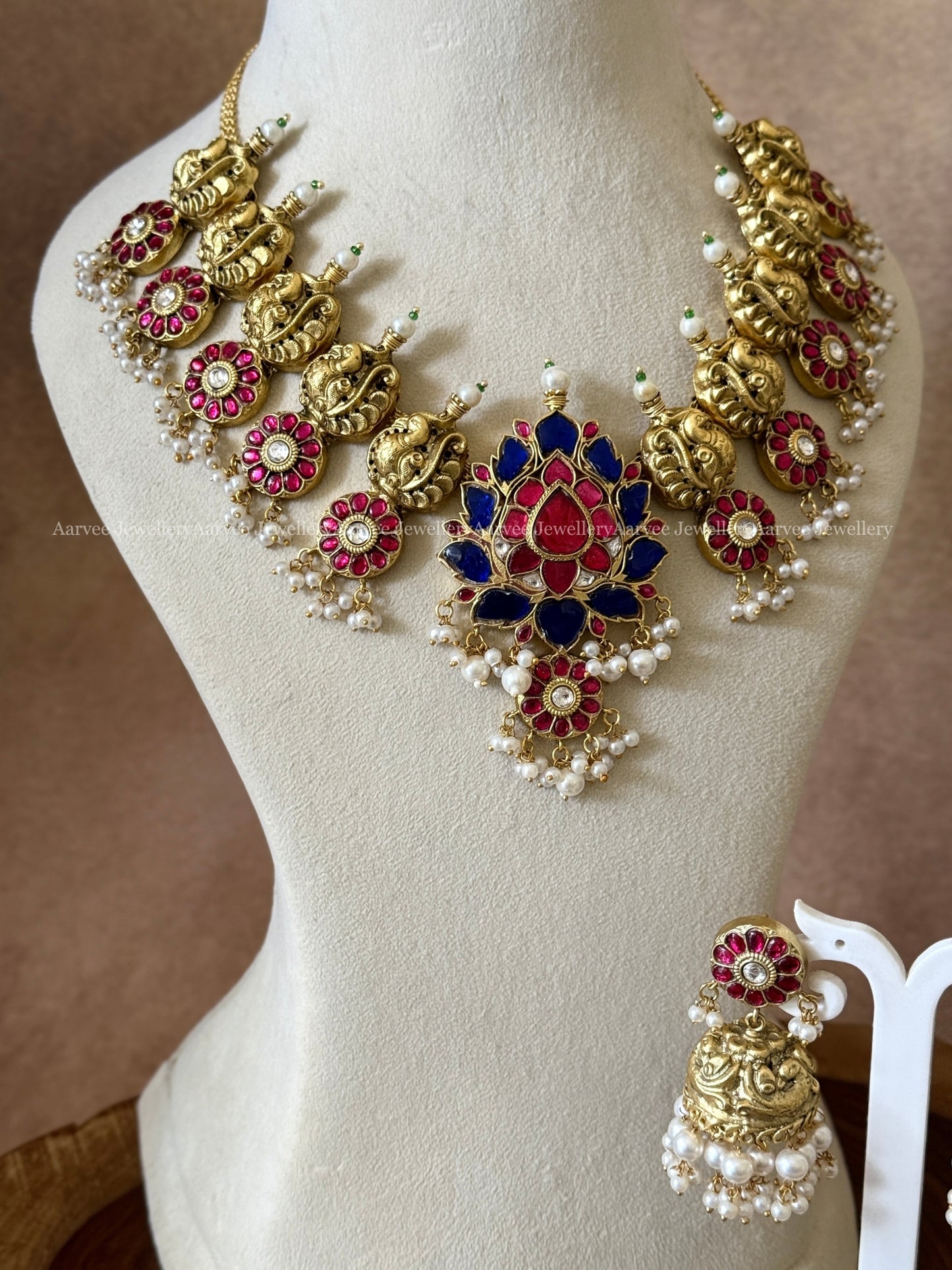 JADAU KUNDAN ANNAM & LOTUS PENDANT PINK AND BLUE STONE NECKLACE SET WITH JHUMKI