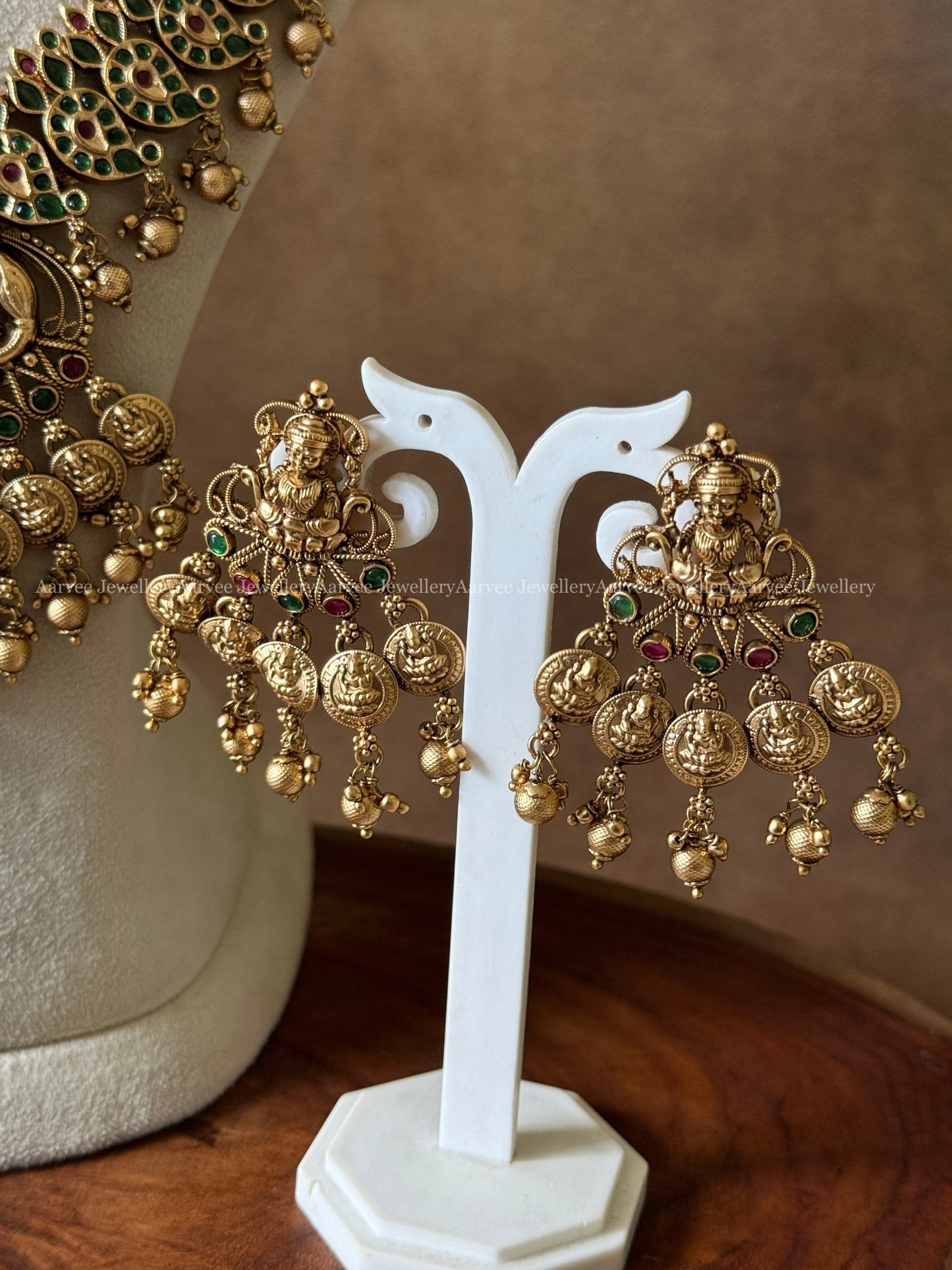 GOLD PEARL BUNCH GREEN STONE MID LENGTH HARAM SET WITH LAKSHMI PENDANT & GOLD BEADS