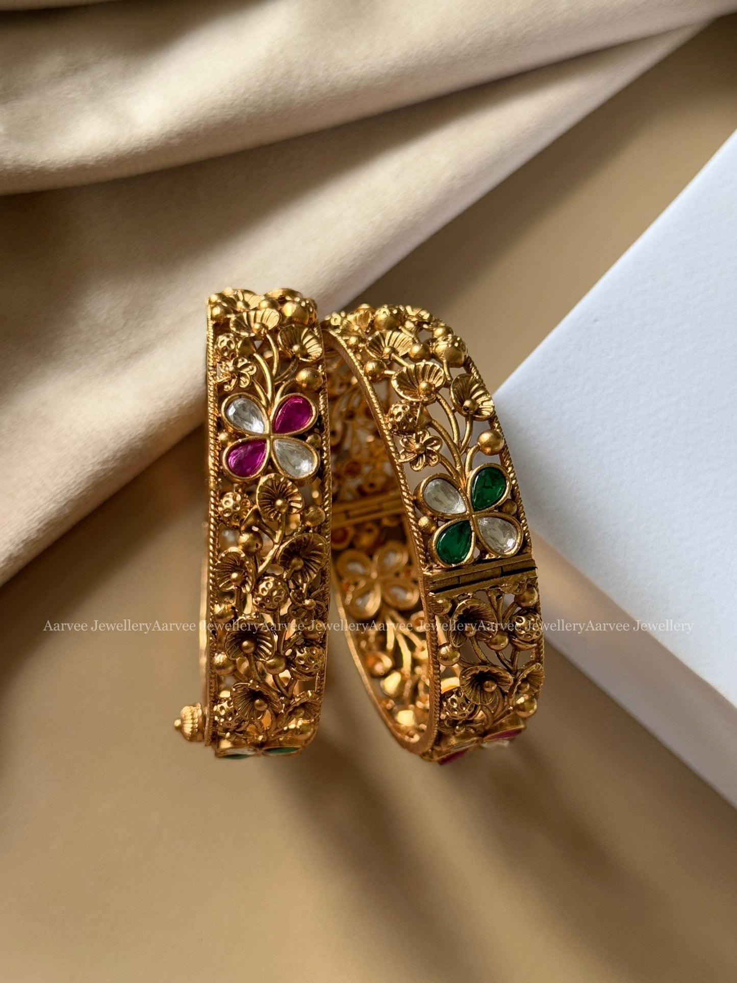 GOLD FINISH BANGLE IN FLORAL DESIGN