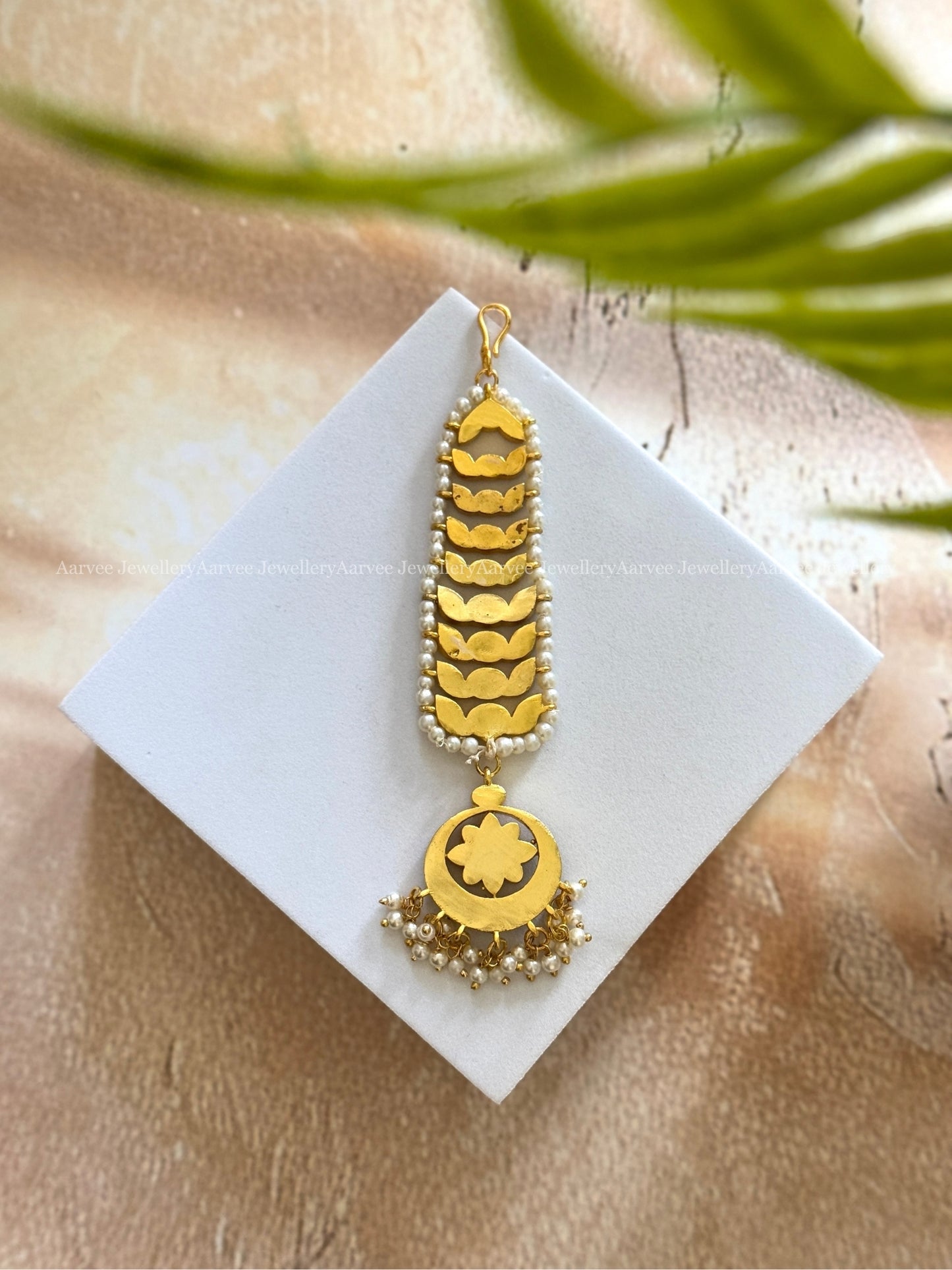 JADAU KUNDAN GREEN STONES FLORAL TIKKA