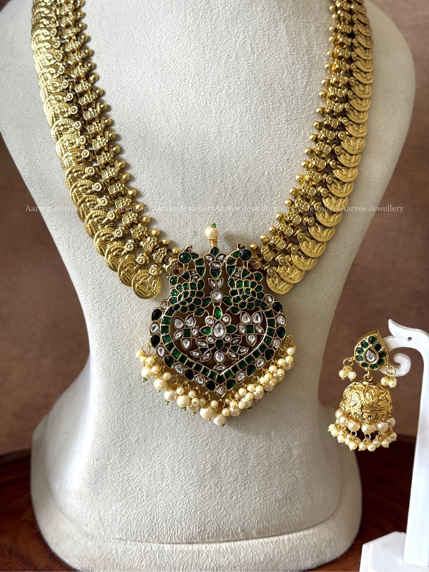 COIN MIDLENGTH CHAIN WITH JADAU KUNDAN GREEN STONE PEACOCK PENDANT & JHUMKI IN PEARL BEADS