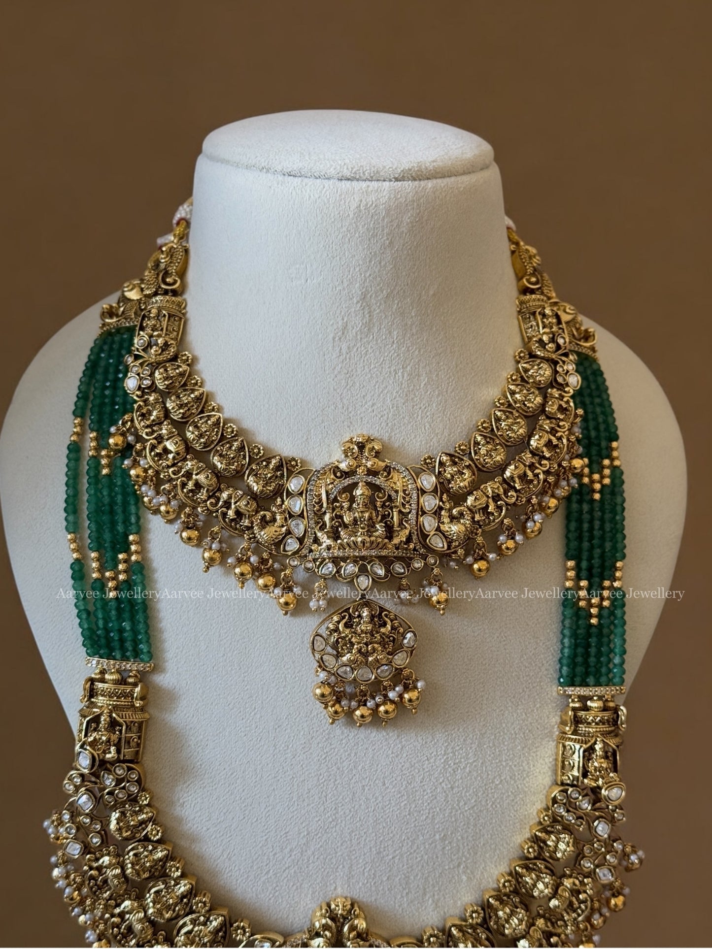 TEMPLE JEWELLERY SEMI BRIDAL SET | GREEN BEADED HAARAM WITH LAKSHMI PENDANT PAIRED WITH A FULL GOLD LAKSHMI NECKLACE IN GOLD BEADS