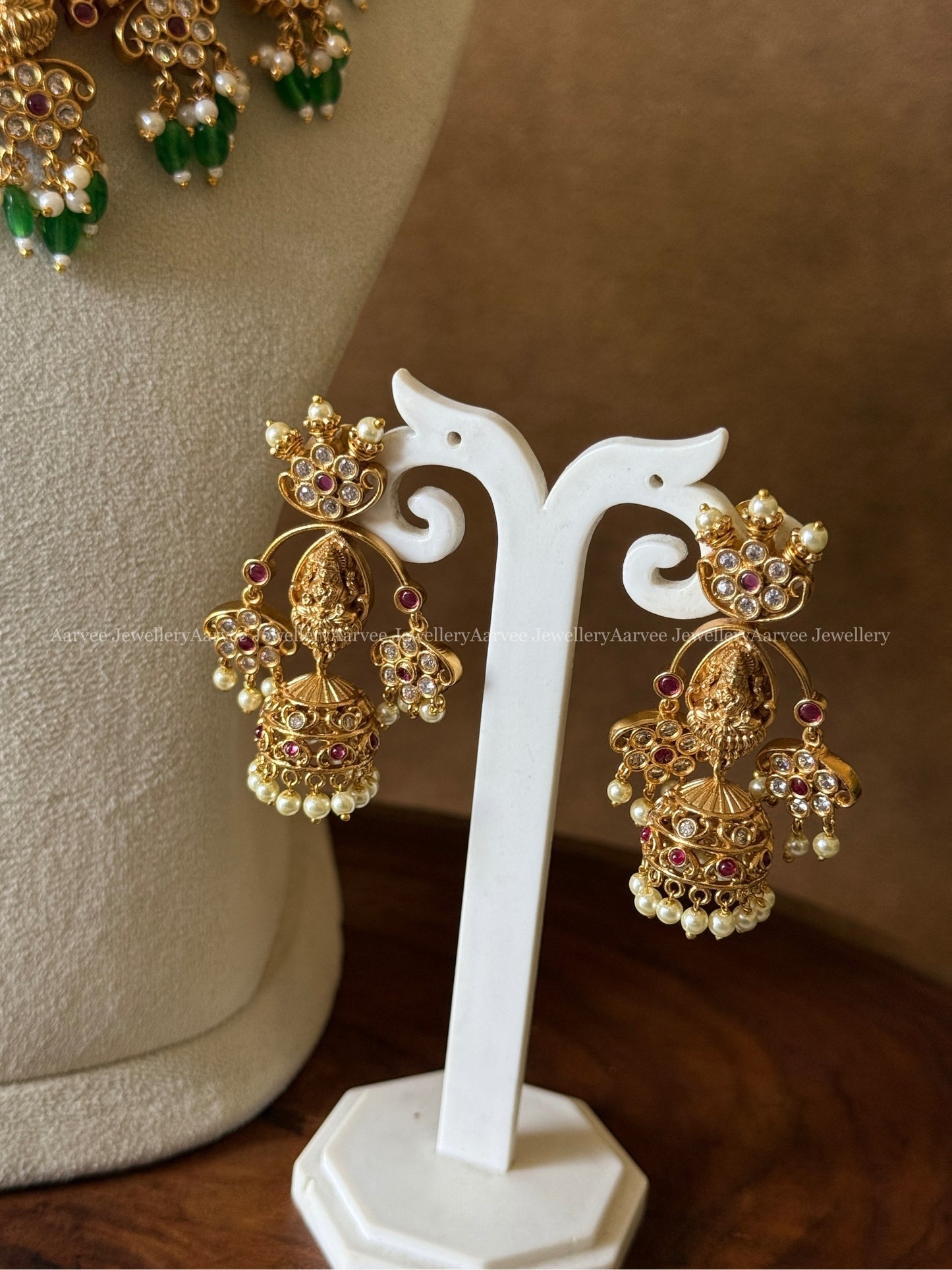 GOLD FINISH LAKSHMI AND RUBY STONE NECKLACE SET WITH GREEN BEADS