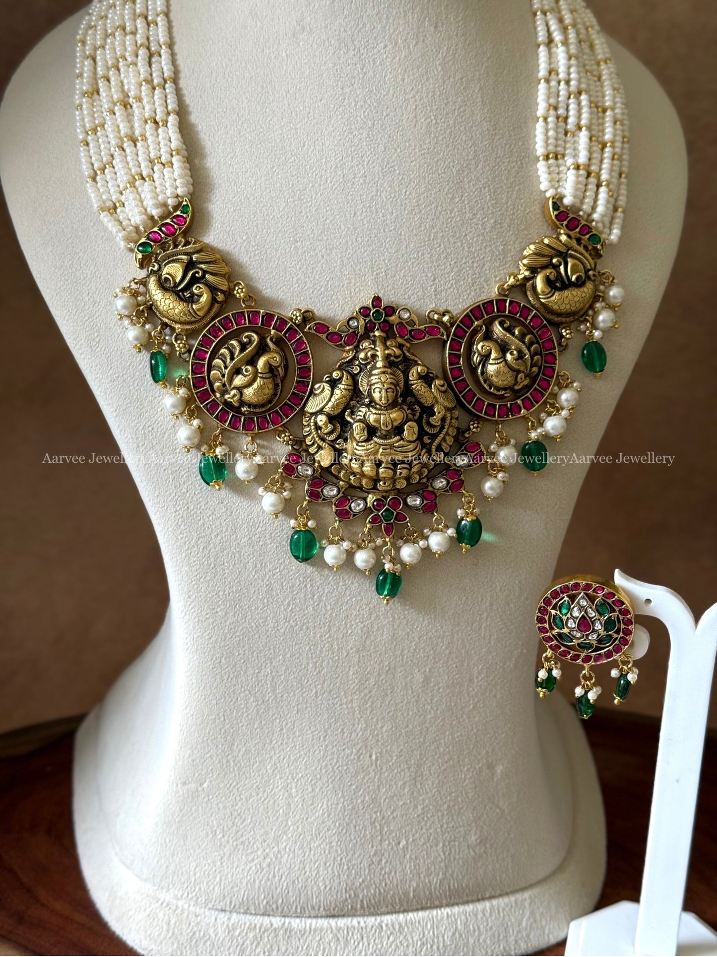 JADAU KUNDAN PEARL BUNCH LAYERED MID LENGTH NECKLACE SET WITH NAKSHI & PEACOCK PENDANT WITH GREEN BEADS