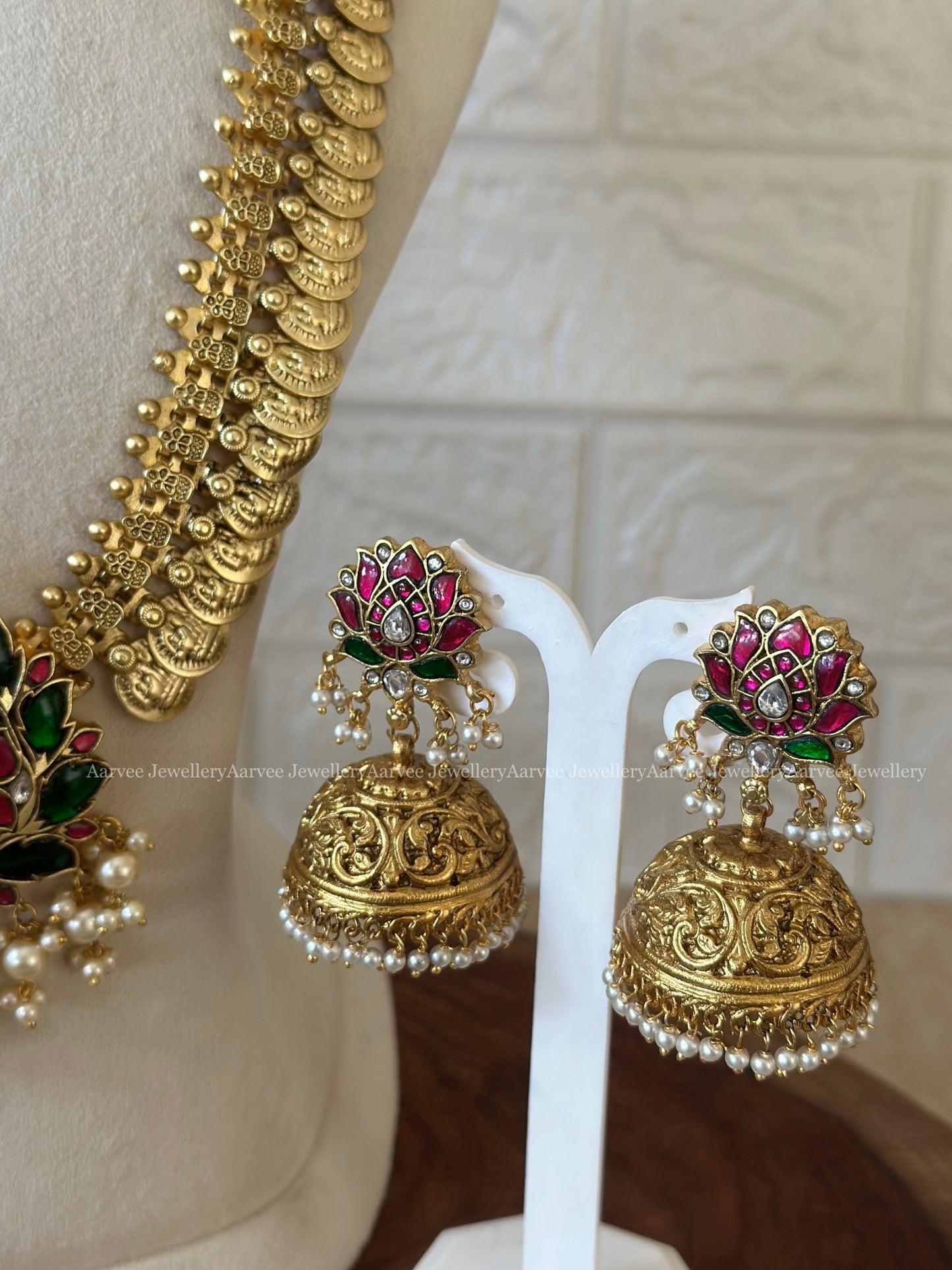 JADAU KUNDAN GOLD COIN MID LENGTH CHAIN WITH LOTUS PENDANT WITH PEARLS AND LOTUS JHUMKI