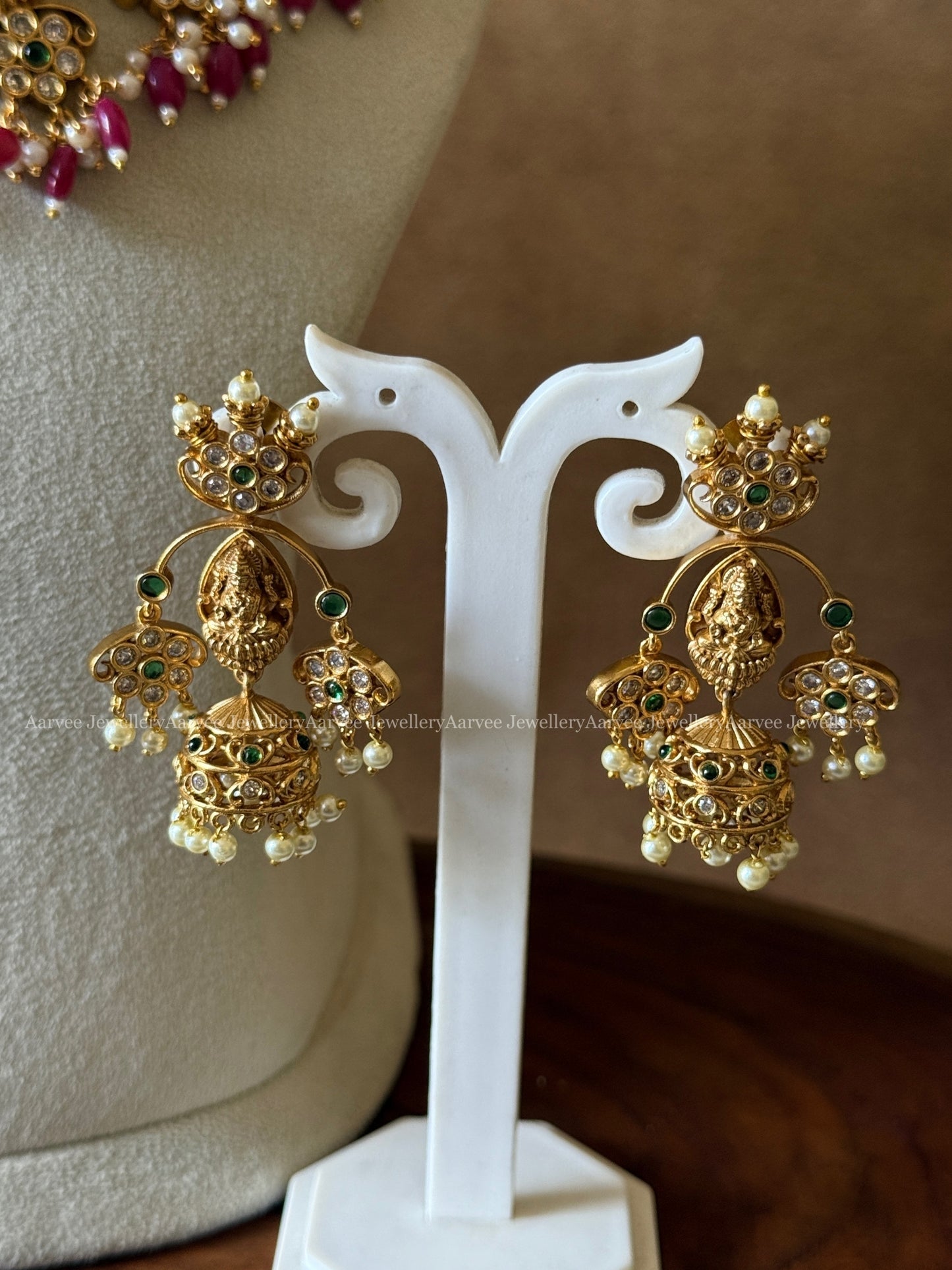 GOLD FINISH LAKSHMI AND GREEN STONE NECKLACE SET WITH RUBY BEADS