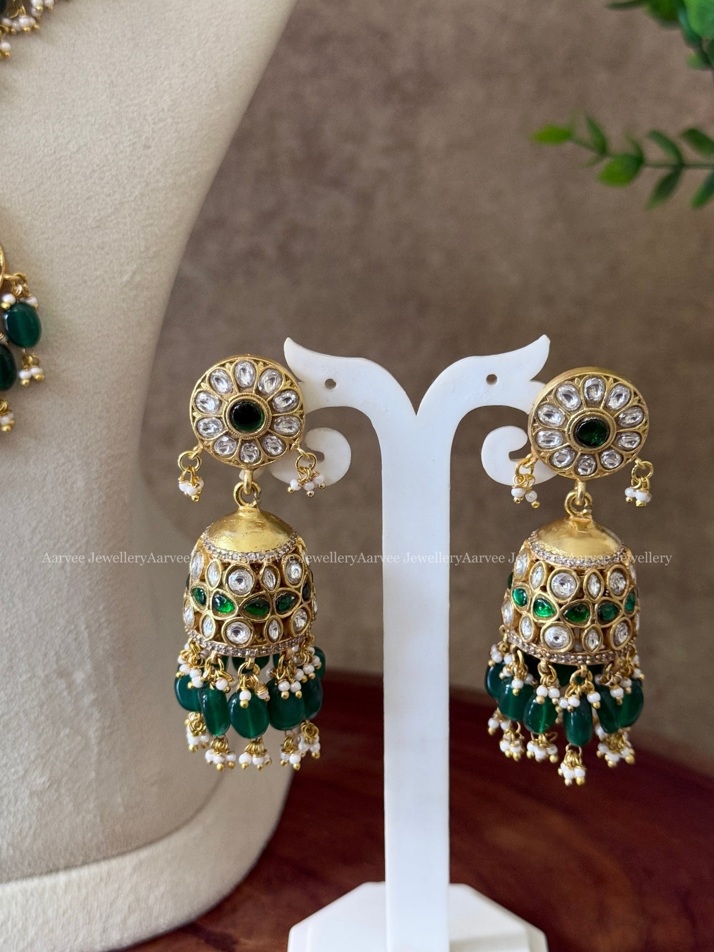 JADAU KUNDAN STATEMENT NECKLACE & FLORAL JHUMKI WITH WHITE STONES & GREEN BEADS