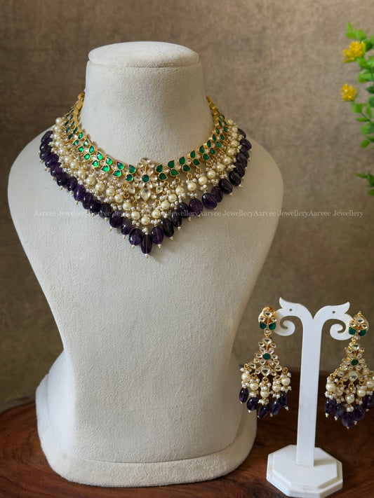 POLKI KUNDAN SET IN TEAR DROP DESIGN AND WITH GREEN STONE AND PURPLE BEADS