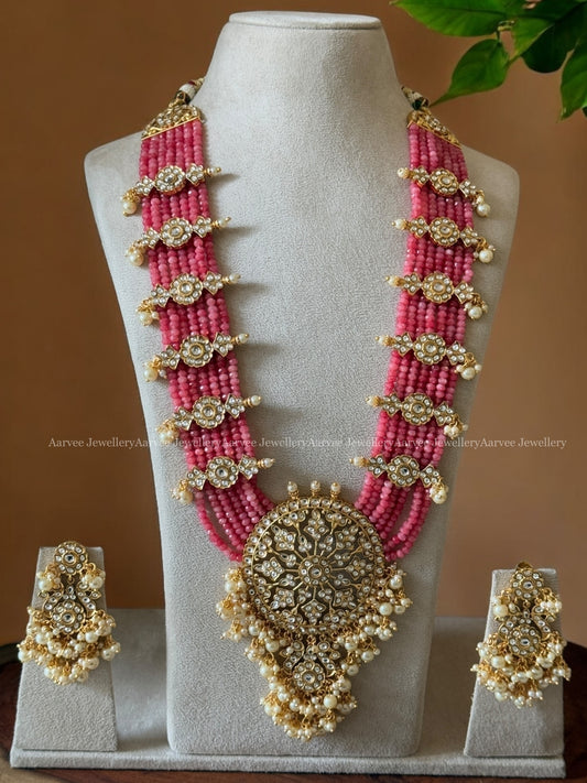 PASTEL PINK BEADED LONG HARAM SET WITH A KUNDAN WHITE STONES PENDANT AND FLORAL SIDE MOTIFS