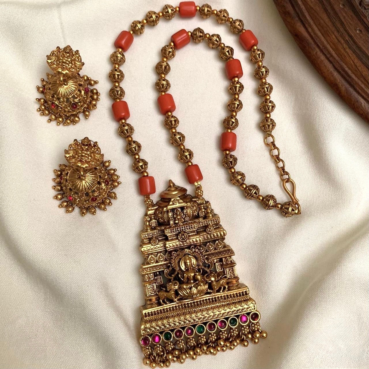 GOLD AND CORAL BEADED MID LENGTH CHAIN SET WITH LAKSHMI PENDANT