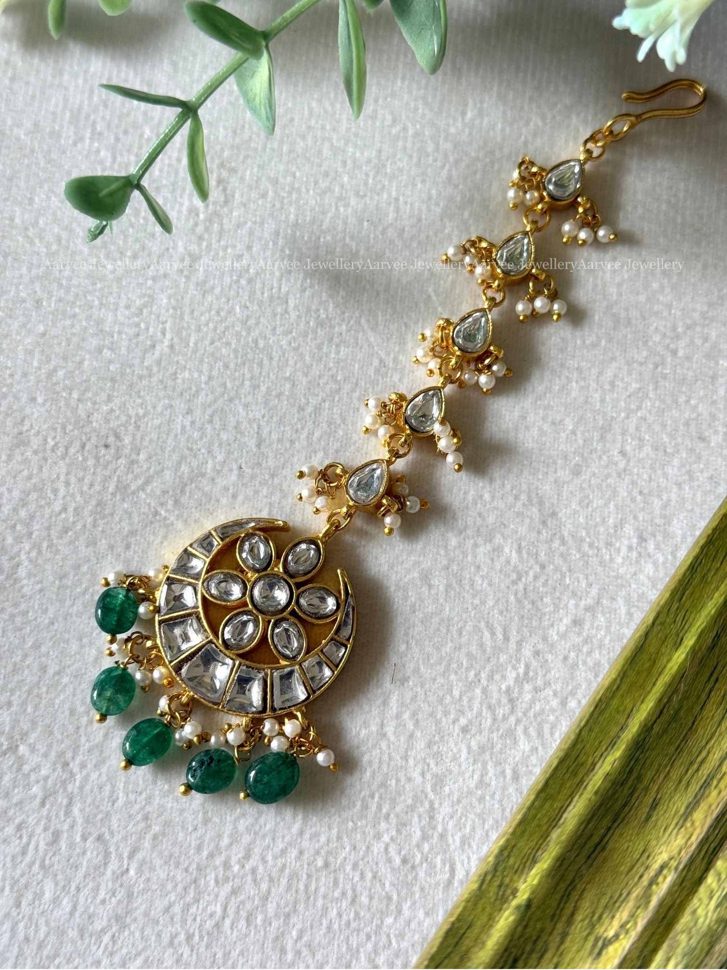 JADAU KUNDAN WHITE STONES CHAND DESIGN TIKKA WITH GREEN BEADS