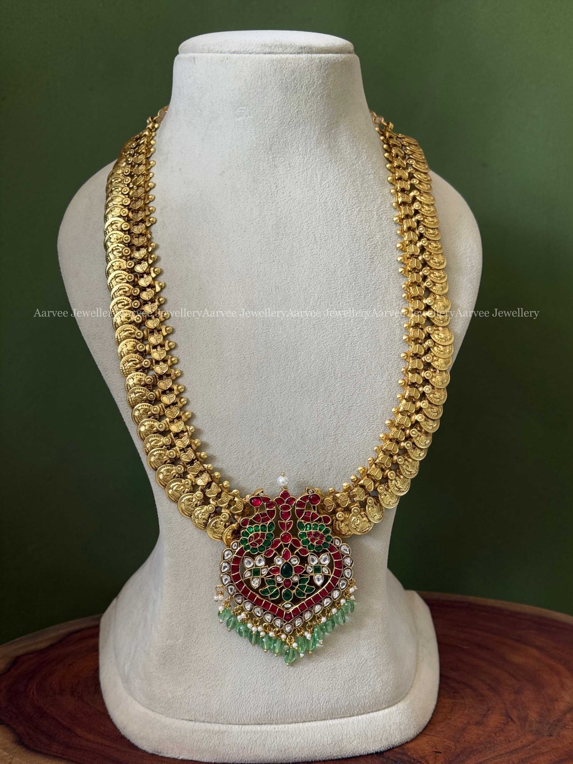 JADAU KUNDAN MID LENGTH GOLD COIN CHAIN WITH PEACOCK PENDANT AND PASTEL BEADS