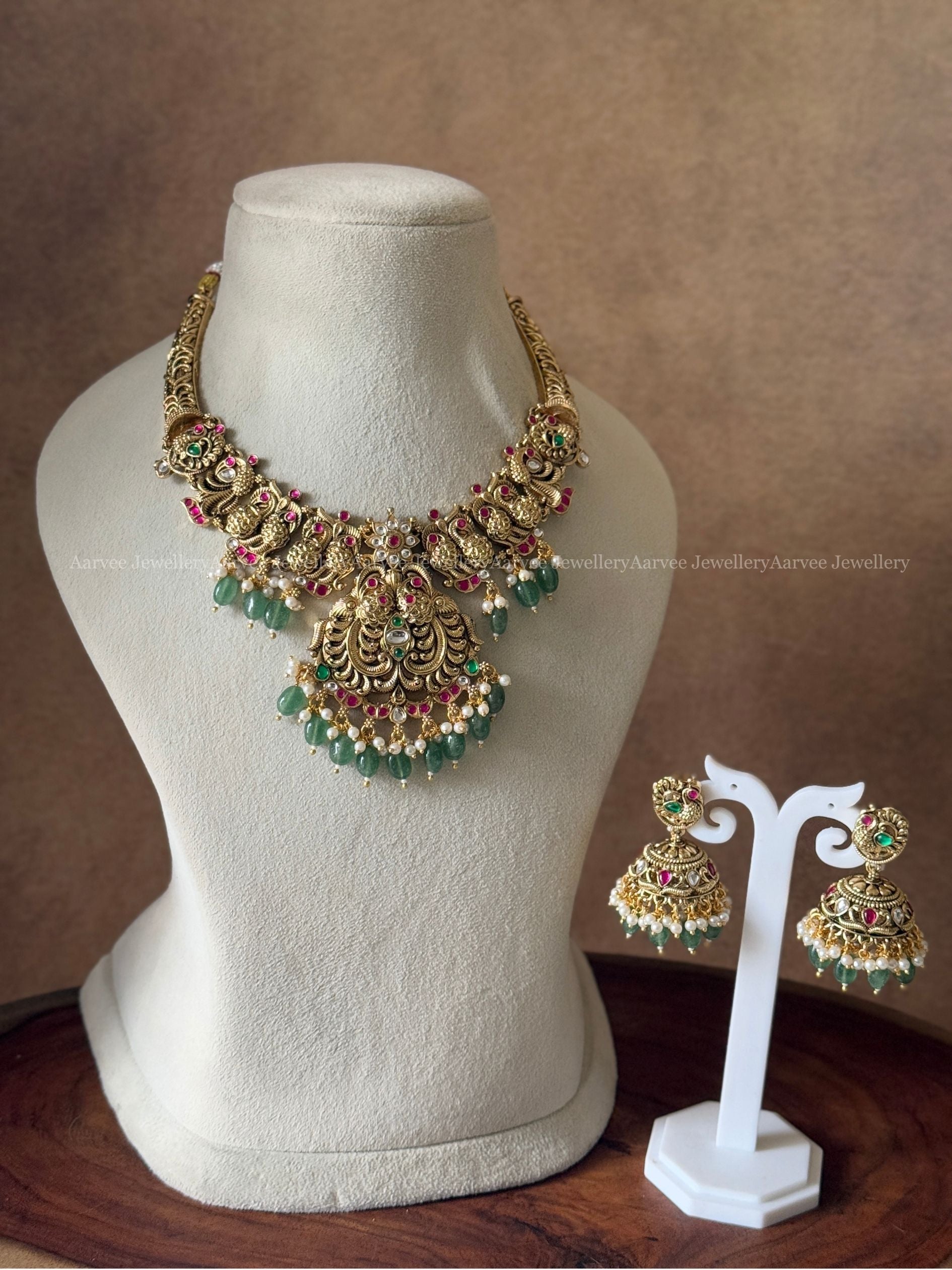GOLD TONE PINK KUNDAN STONE PEACOCK MOTIF KANTI NECKLACE SET WITH GREEN BEADS