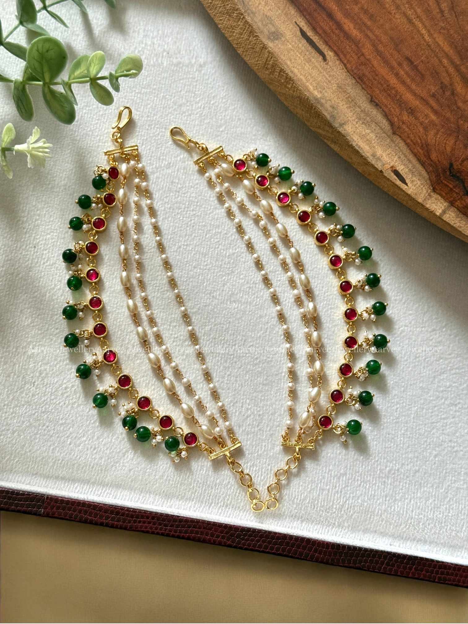 JADAU KUNDAN LAYERED PEARL EAR CHAIN WITH RUBY STONES AND GREEN BEADS
